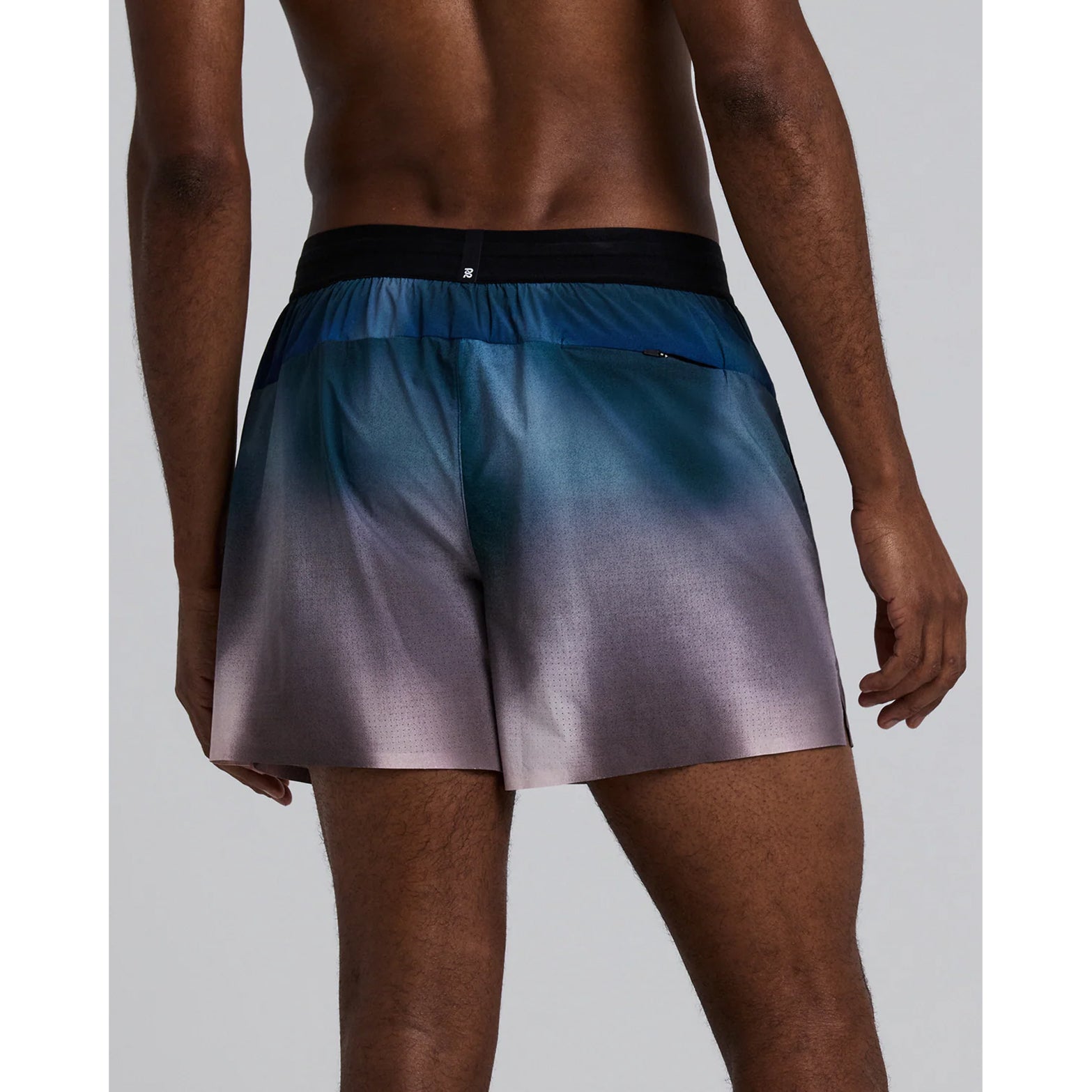 Bandit Vento™ 5 Inch Run Shorts men's in Flow State Aegean Multi — back view worn on model showing back zip pocket, bonded cutaway split and flow state aegean multi Vento™ four-way stretch fabric