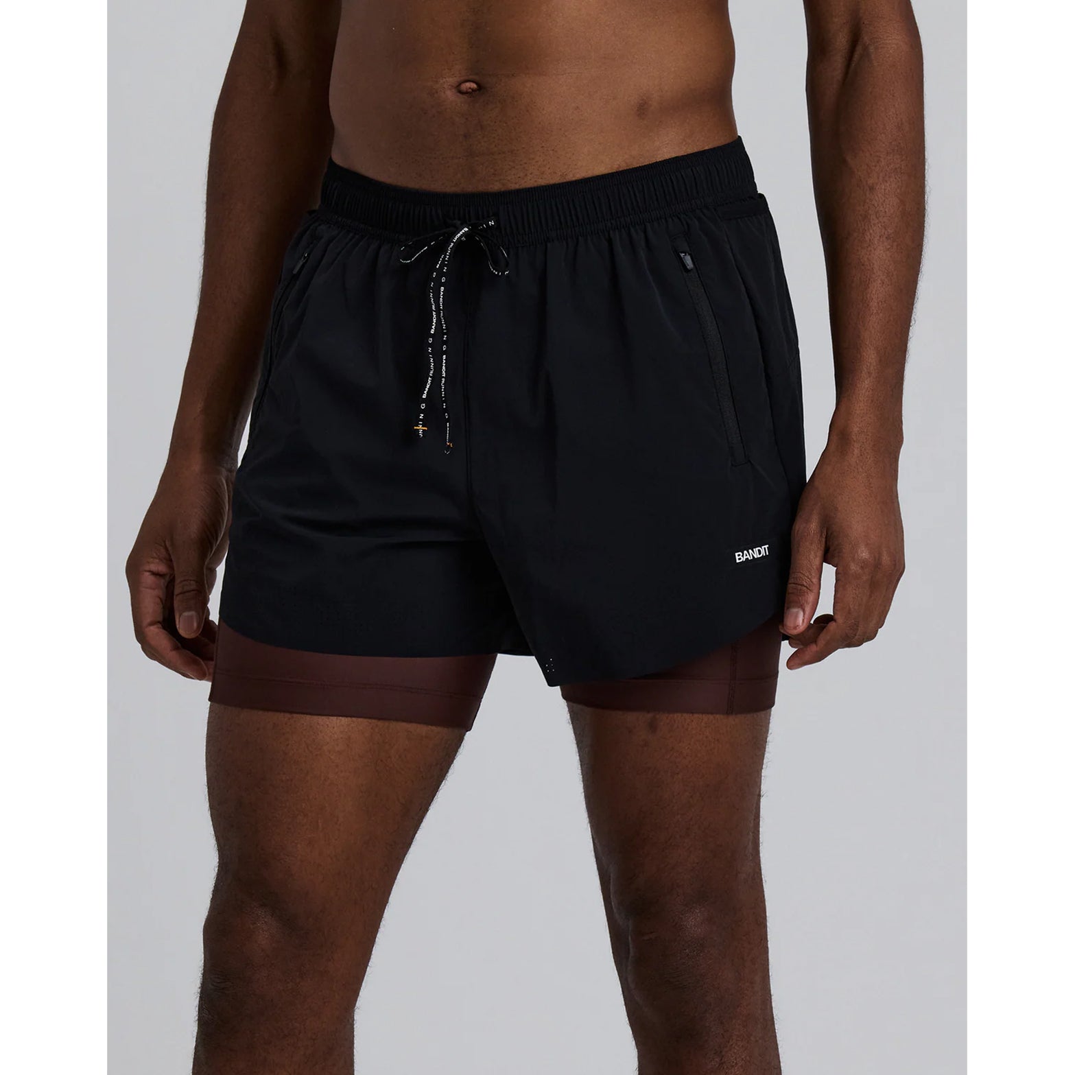 Men's Bandit Vento Next Gen 2-in-1 Run Short Black front view showing built-in compression liner with reflective branding and breathable construction