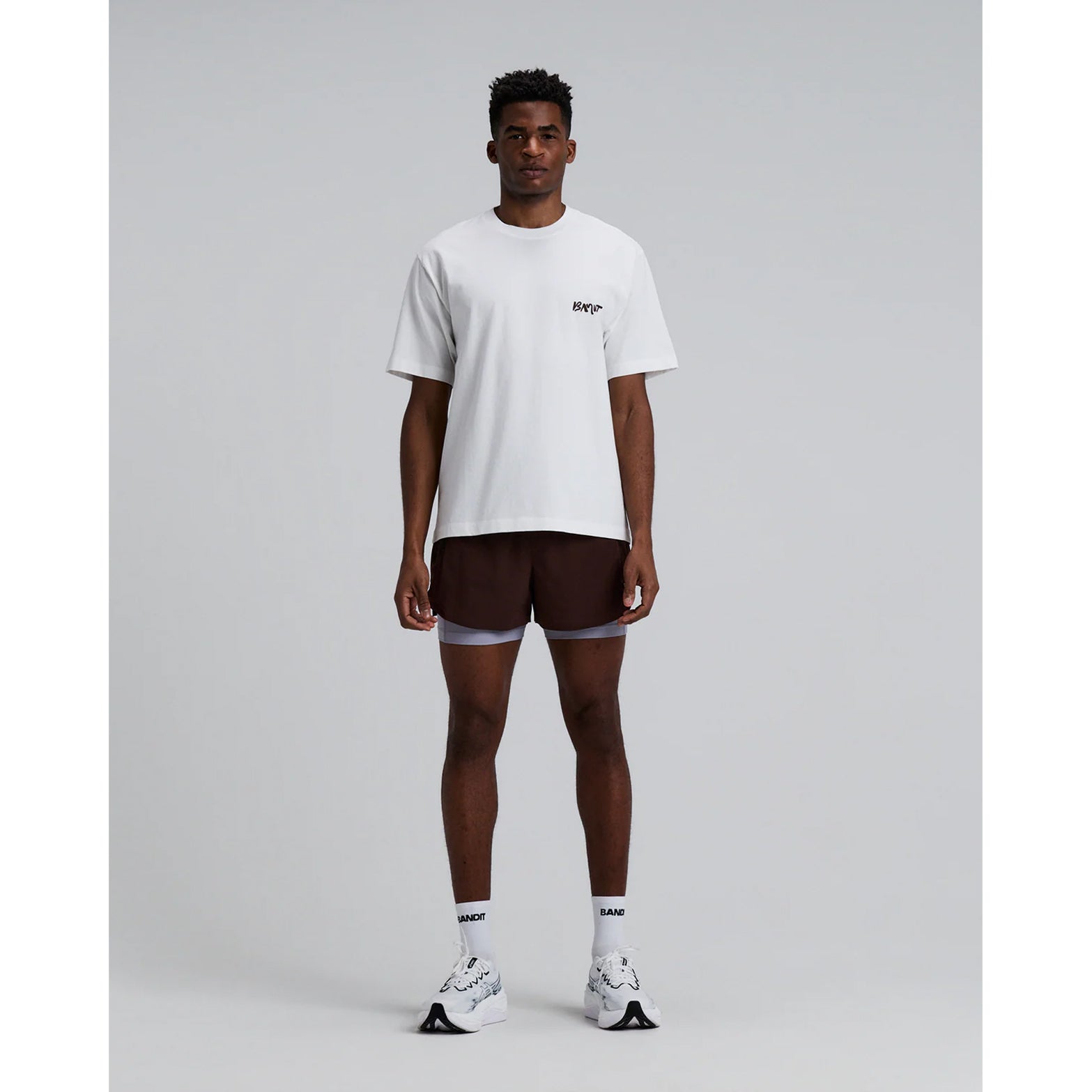 Men's Bandit Vento Next Gen 2-in-1 Run Short Cacao full body front view on male runner showing breathable Vento fabric with SoLite compression liner