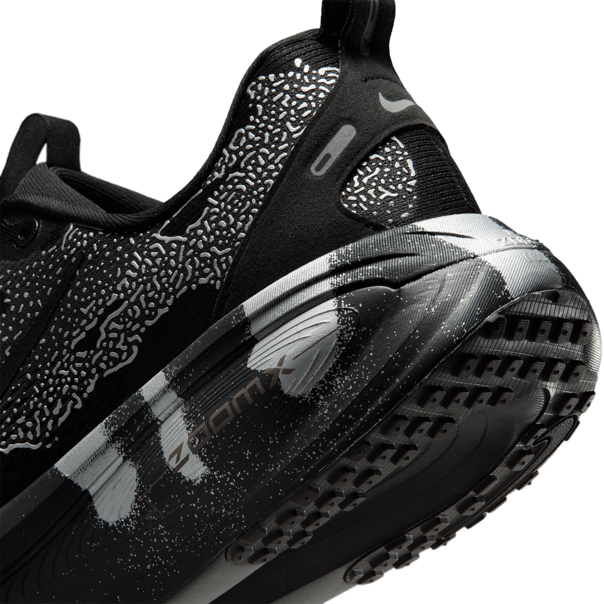 Nike Vomero 18 men's running shoe in Iron Grey / Black / Light Smoke Grey — angled side view showing iron grey engineered mesh upper, black and light smoke grey accent detailing and dual-density ZoomX ReactX midsole profile
