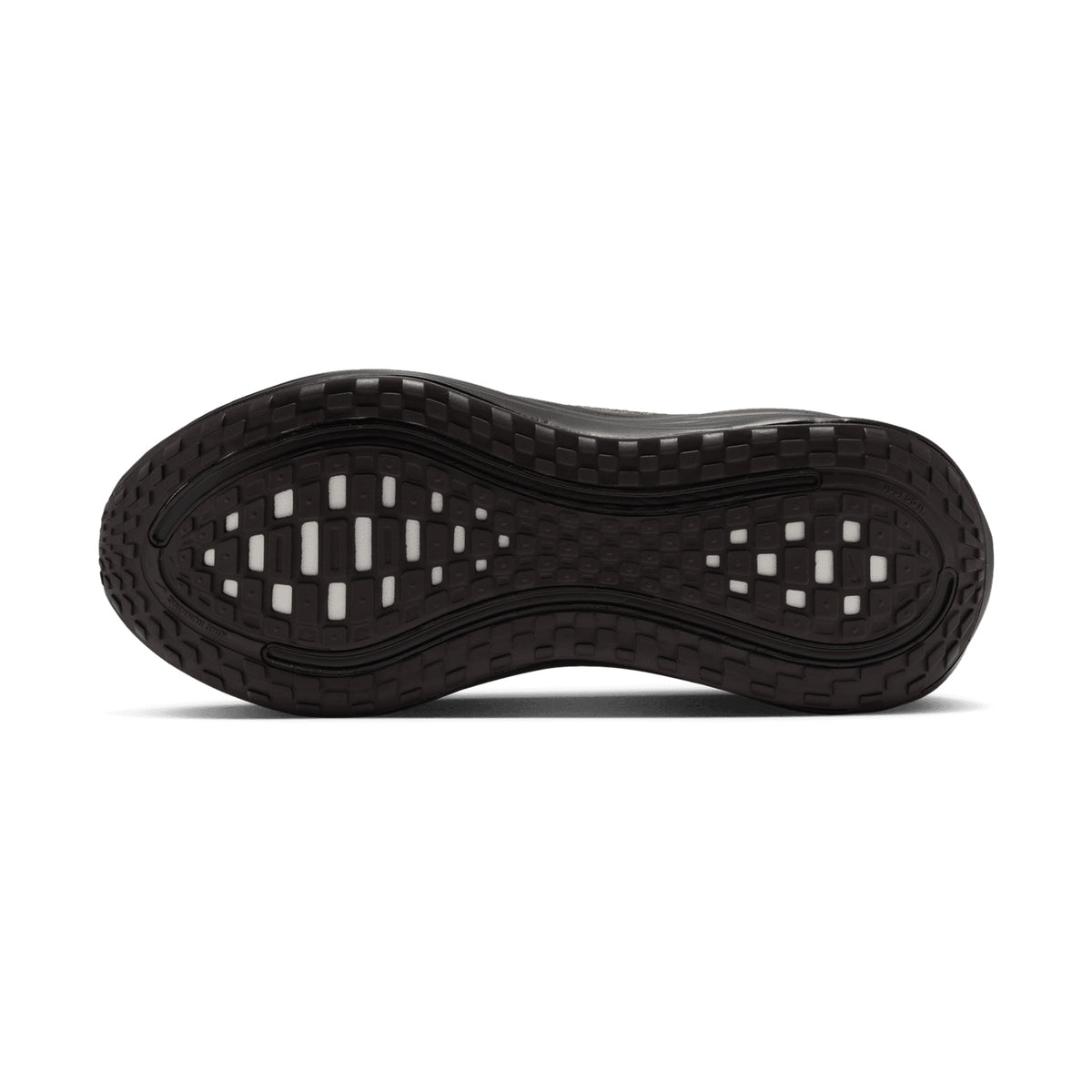 The dark brown rubber outsole of a Nike Men’s Vomero Plus Running Shoes Dark Hazel / Black / Desert Khaki, featuring a grid-patterned tread and white ZoomX foam cushioned inserts in the forefoot and heel.