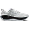 Nike Vomero Plus men's running shoe in White / Metallic Silver / Black — outer view showing white engineered mesh upper with metallic silver accent detailing, black contrast and full-length ZoomX foam midsole profile