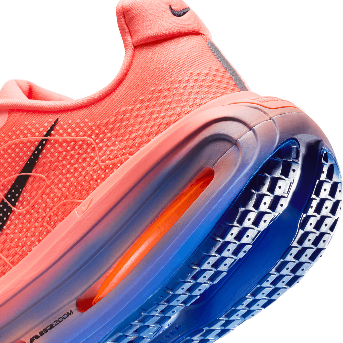 Men's Nike Vomero Premium Running Shoes Atomic Pink Racer Blue angled side and heel view showing dual Air Zoom units surrounded by ZoomX foam with Waffle outsole for plush springy daily road running