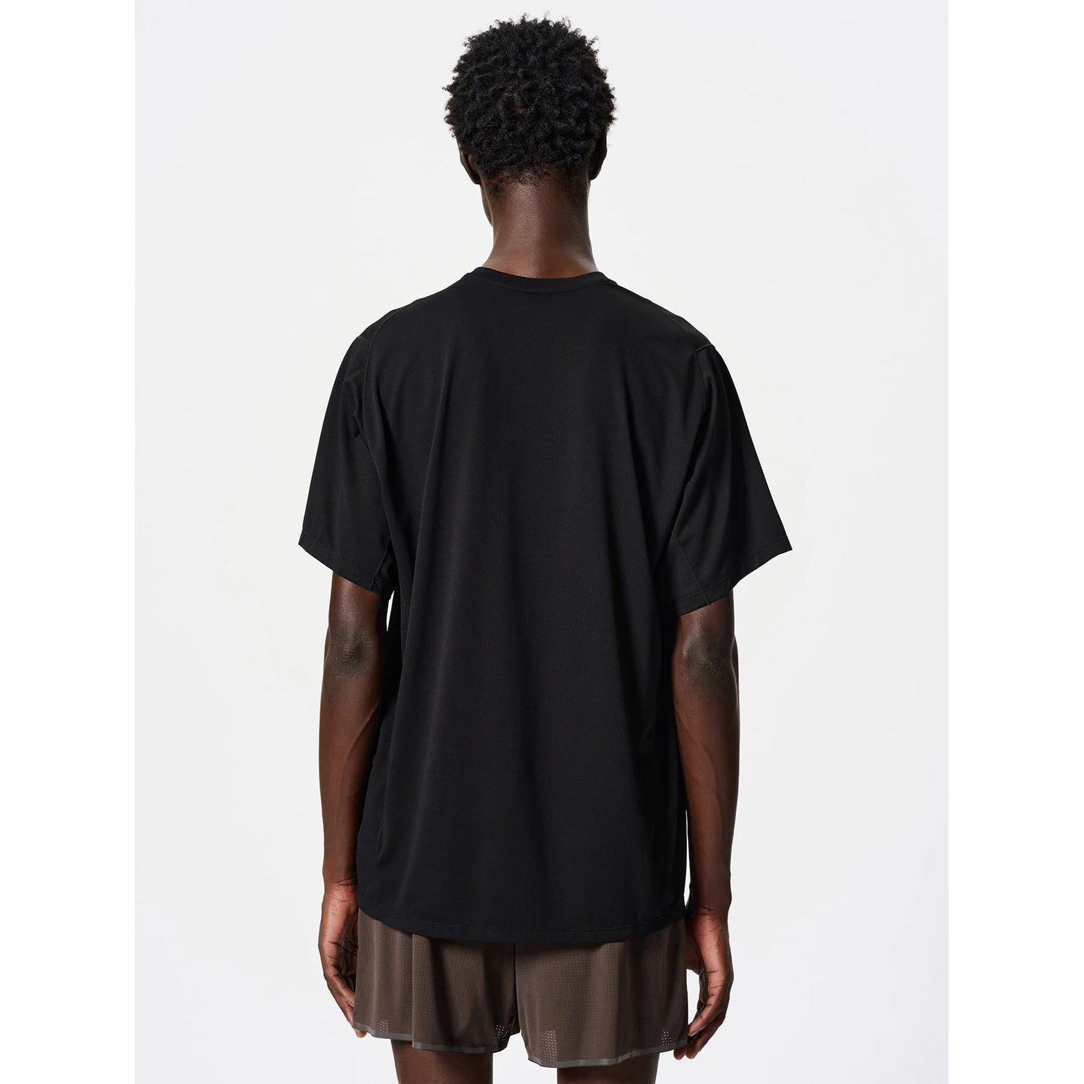 Goldwin Men's WF-Dry Tee Black back view on male runner showing quick-dry waffle fabric construction with UV protection tested to AS/NZS 4399 standard