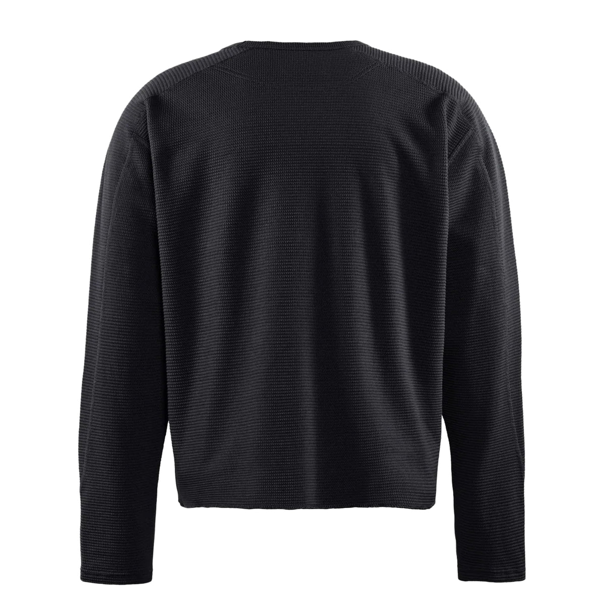 Back view of the District Vision Men’s Waffle Top Black, a long-sleeve shirt in a textured waffle-knit pattern.