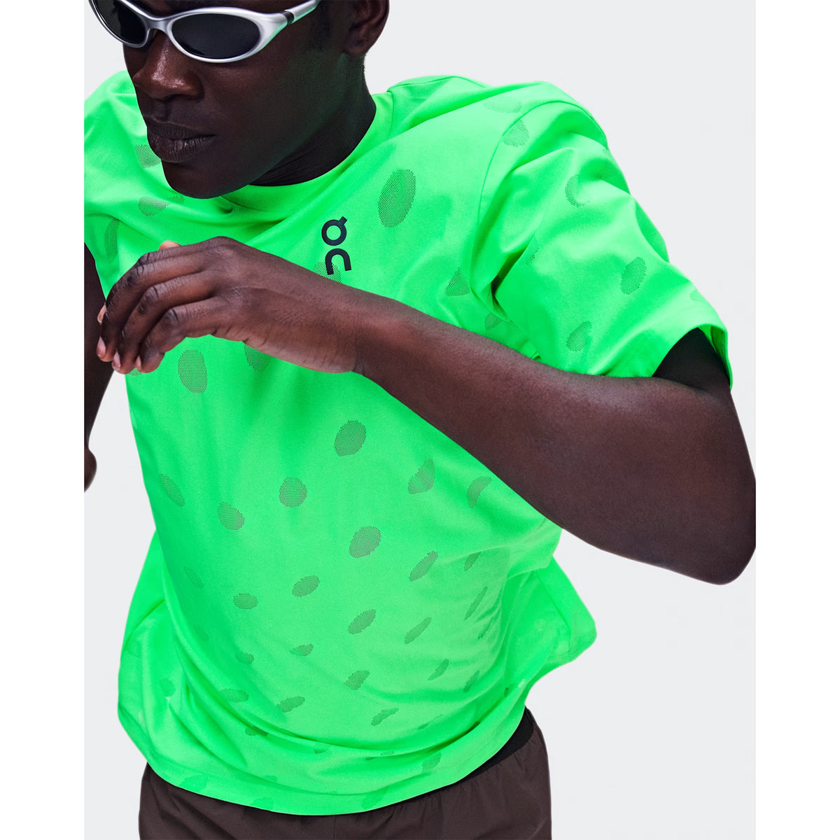 Men's On Zero-T Breathe Verdite front view on male runner in motion showing ultralight functional jacquard construction with On DryTec breathable moisture-wicking fabric for distraction-free fast training performance