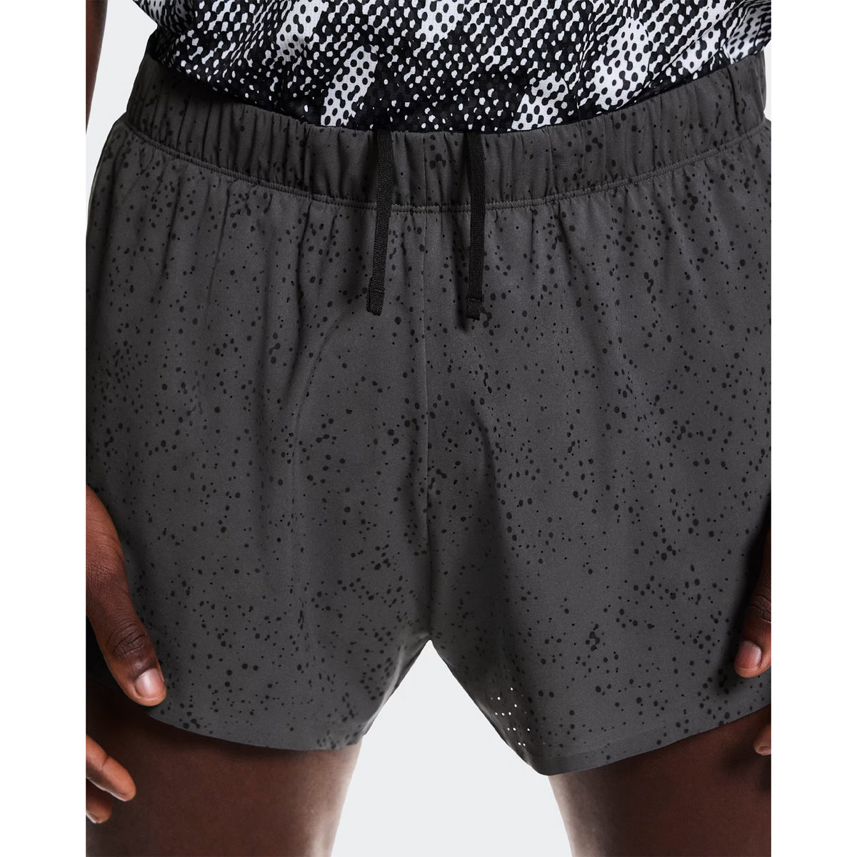 Men's On Zero Shorts Grey Black close-up front view showing stretch-woven fabric, adjustable waistband and quick-drying inner brief construction