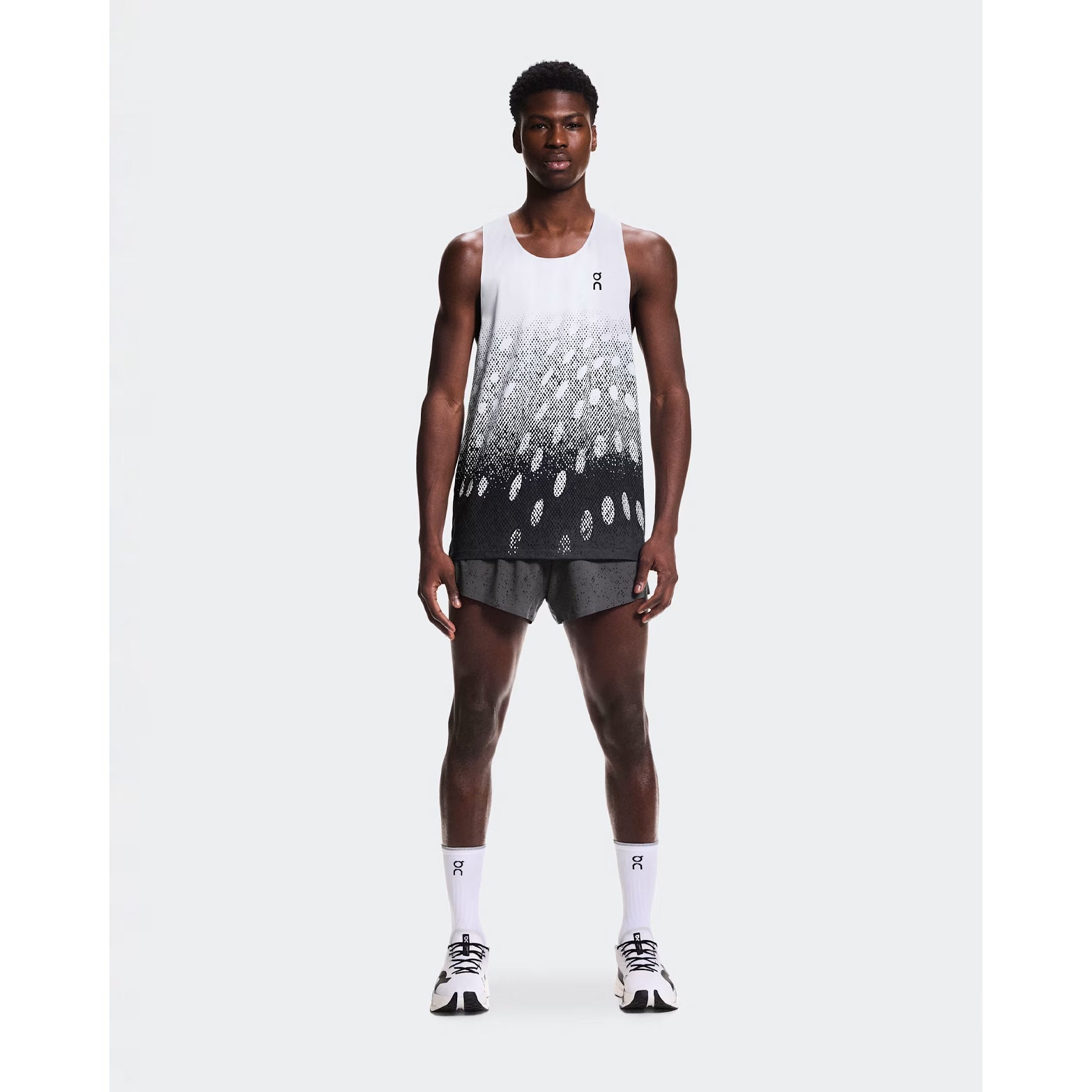 Men's On Zero Shorts Grey Black full body front view on male runner showing lightweight race-ready performance construction