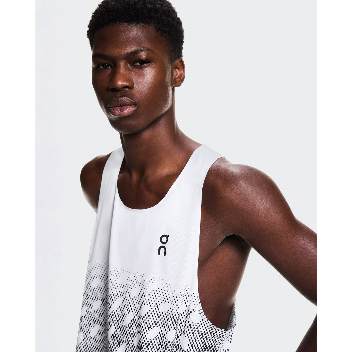 Men's On Zero Singlet Black Grey White close-up front view showing On DryTec technical fabric, expressive graphic and ultra-lightweight construction