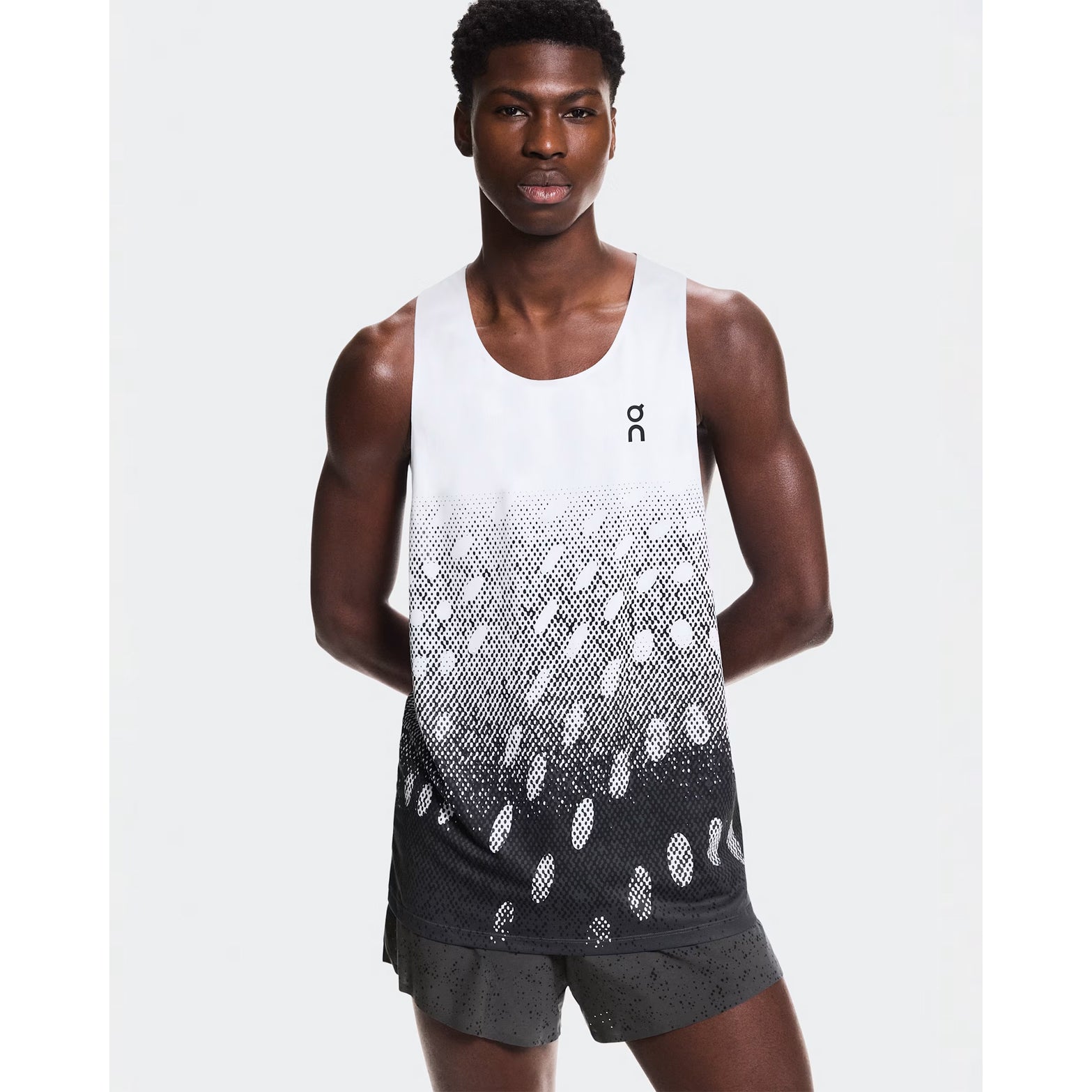 Men's On Zero Singlet Black Grey White front view on male runner showing expressive graphic inspired by On athlete prints and race-ready fit