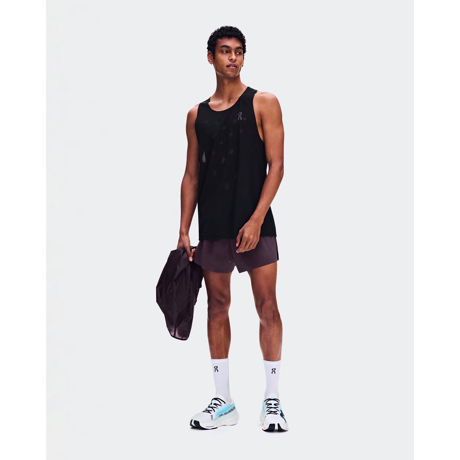 Men's On Zero Tank Breathe Black front full body view on male runner showing ultralight OAC-inspired jacquard tank with DryTec breathable construction for race day and fast training performance