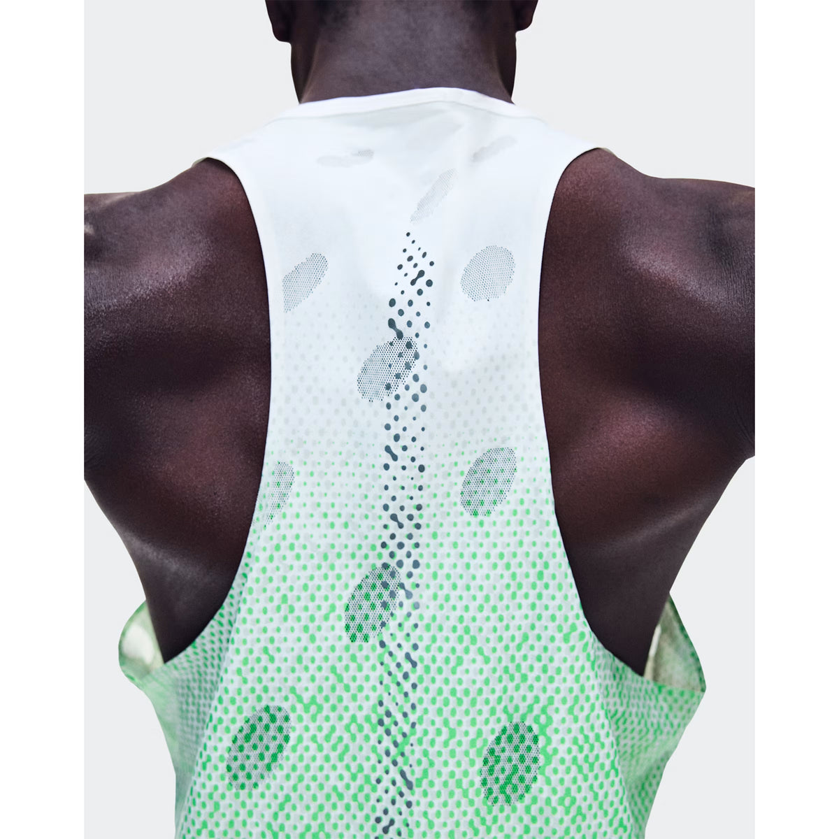 Men's On Zero Tank Breathe Verdite close-up of back showing functional jacquard construction with signature reflective detailing and minimal seam design for distraction-free race day performance