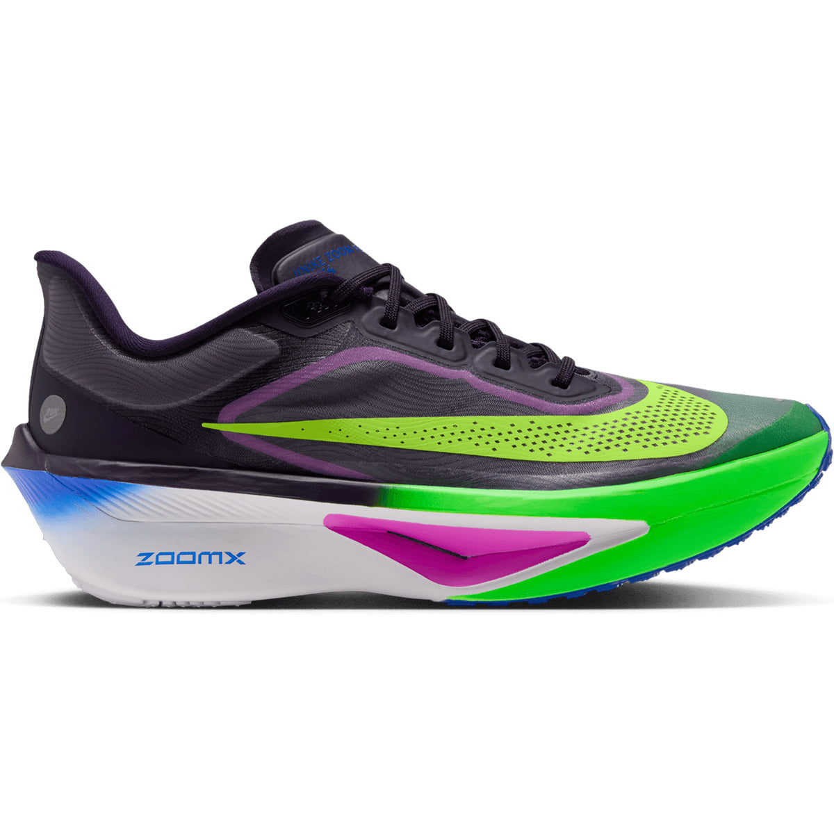 A vibrant men’s running shoe from Nike, the Zoom Fly 6 RSG in Purple Dynasty, Volt, and Fuchsia Dream showcases a black upper with neon green (Volt) at the toe, purple accents, and a white sole detailed with blue and magenta. Featuring responsive ZoomX foam in the midsole and the word “ZoomX” printed next to its embedded carbon-fiber plate for optimal performance.