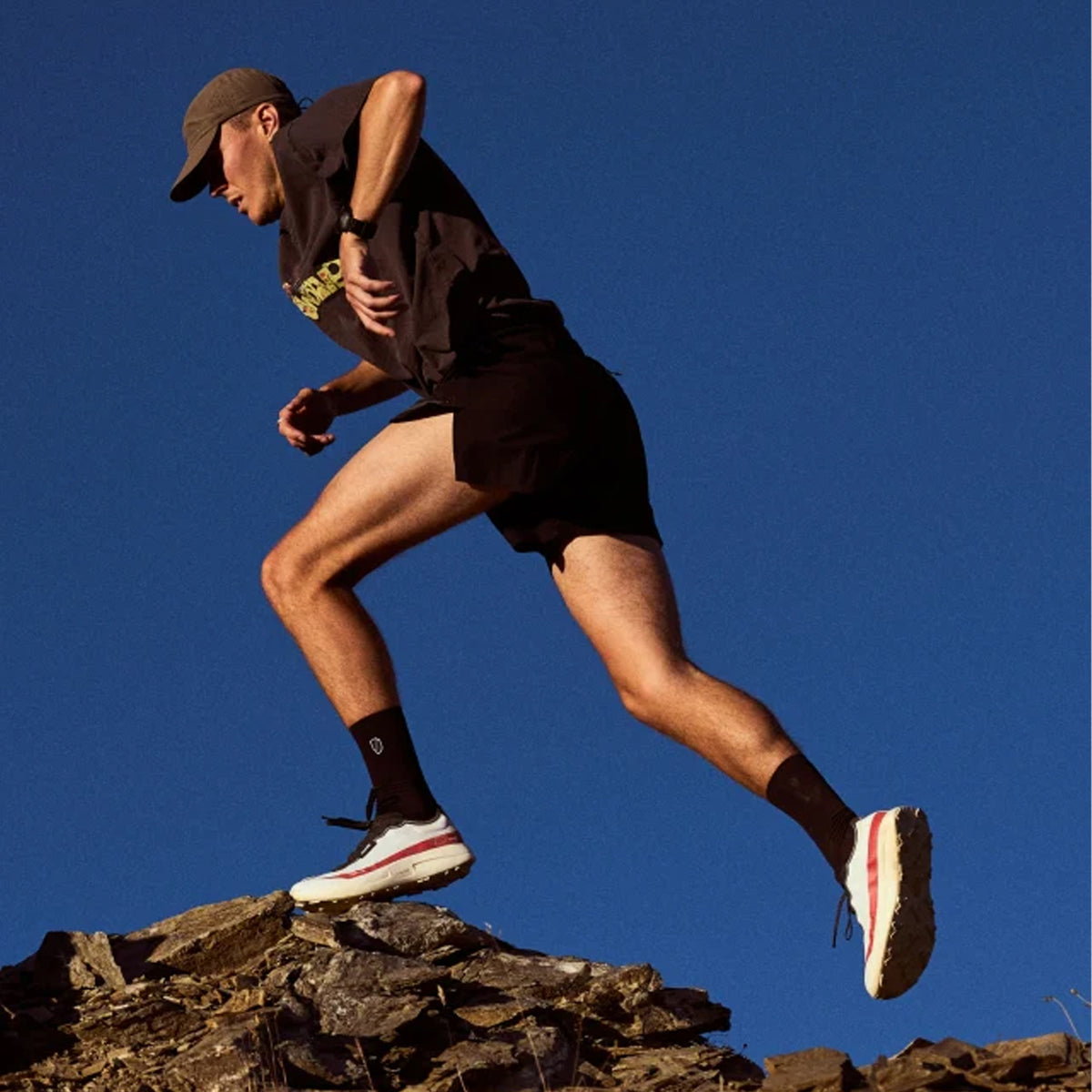 Men's norda 005 Trail Running Shoes Laser on male trail runner in motion showing lightest trail super shoe with pure Arnitel TPEE midsole and Vibram Megagrip Elite for maximum energy return and stability during technical trail racing