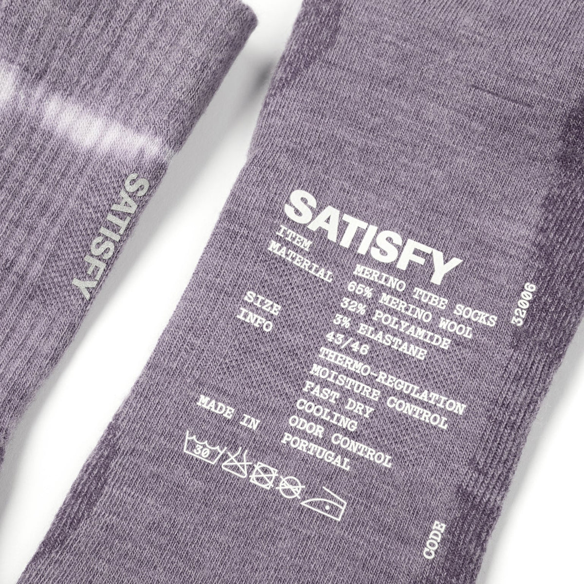 Satisfy Merino Nylon Tube Socks Dusk close-up of hem showing rib-knit structure for secure non-restrictive fit with printed exterior care instructions