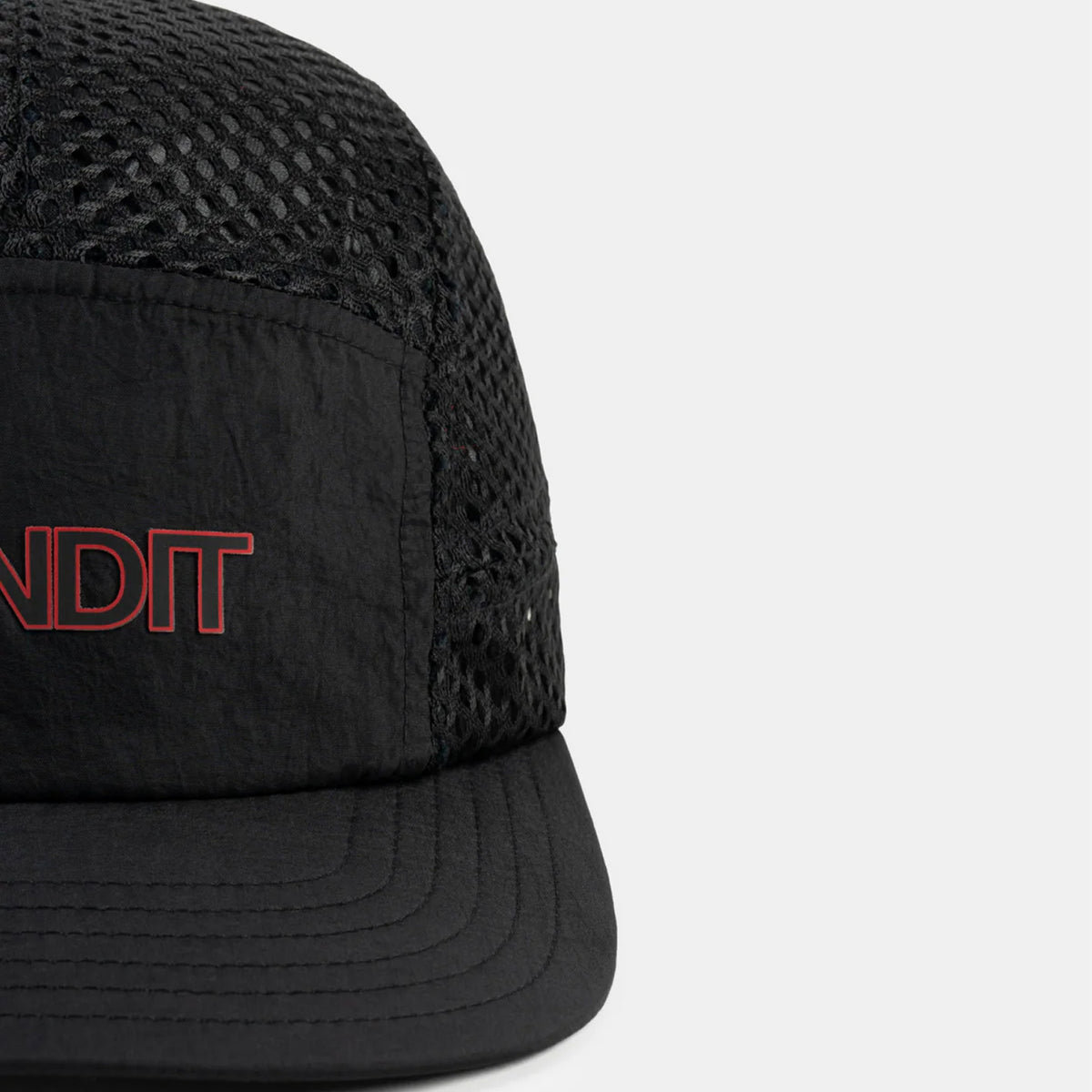 Bandit Mesh HumoFit Run Hat Black close-up of front showing printed Bandit logo with lightweight mesh construction and branded taping detail
