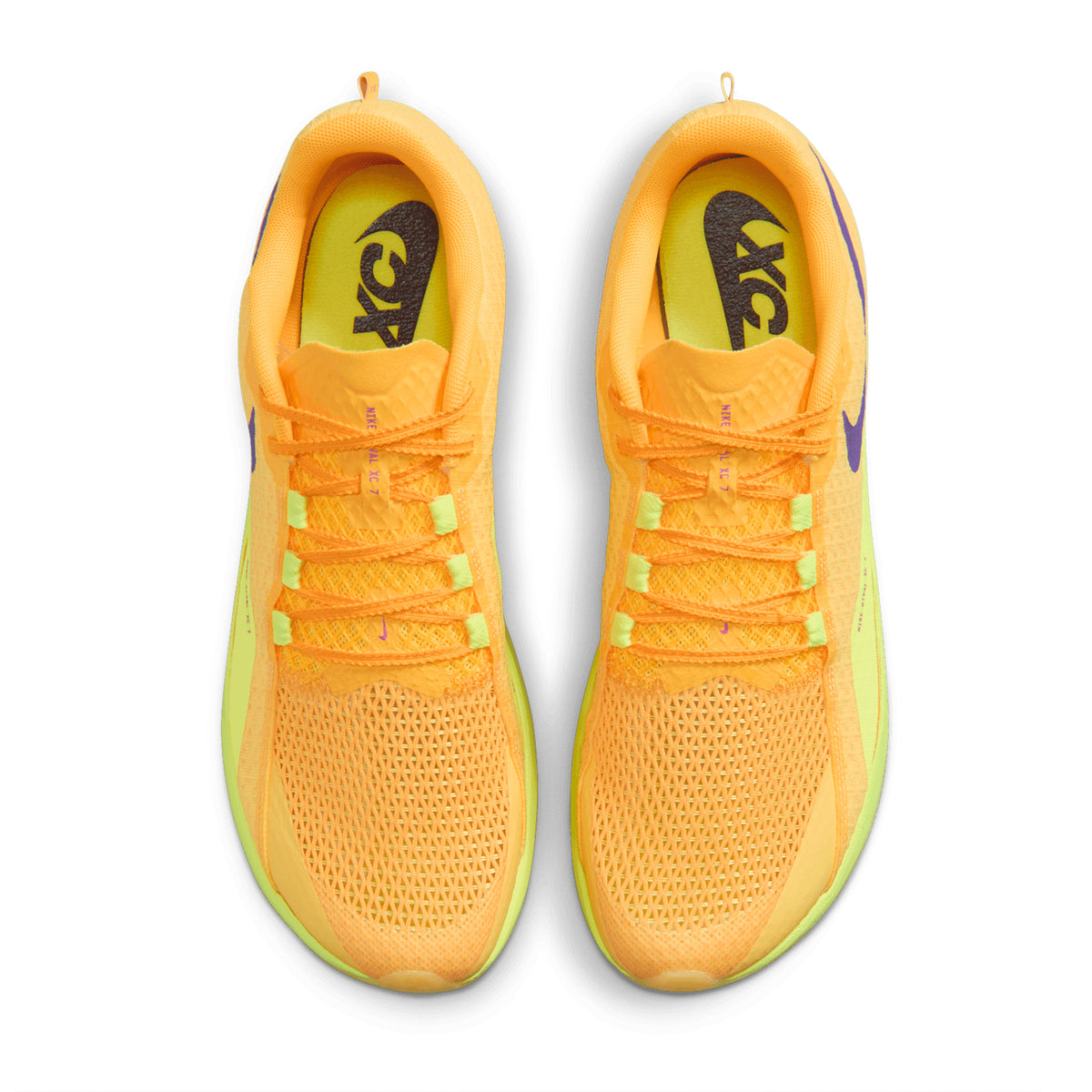 A pair of Nike Zoom Rival XC 7 Running Spikes in Citron Pulse, Indigo Burst, and Blue Void, featuring breathable mesh uppers, cross-country spikes, orange laces, and purple Nike XC branding, shown from above against a white background.