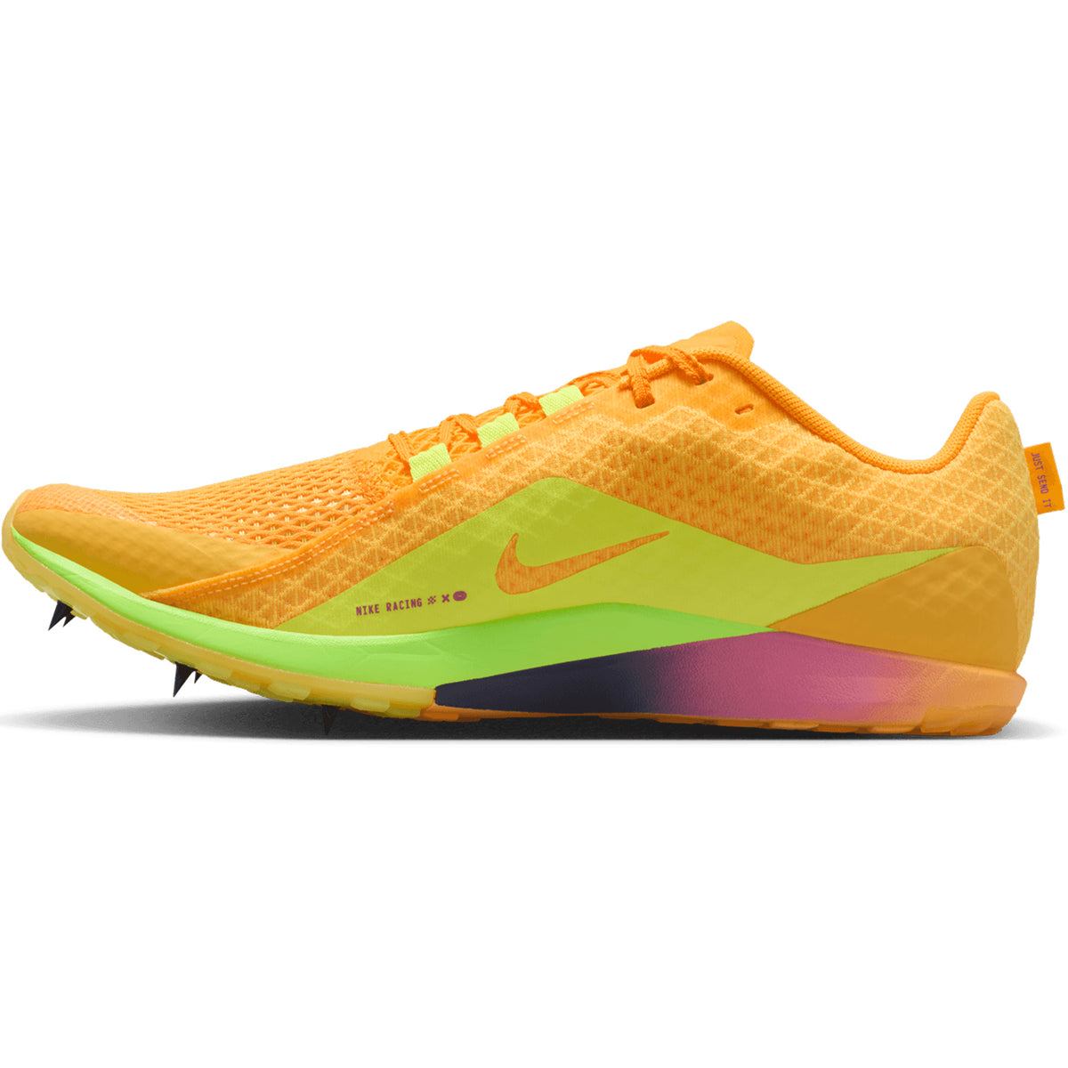 A side profile view of the Nike Zoom Rival XC 7 running spikes in Citron Pulse, Indigo Burst, and Blue Void, featuring a breathable mesh upper with vibrant orange hues, a neon green and yellow midsole, and striking pink and blue accents near the heel.