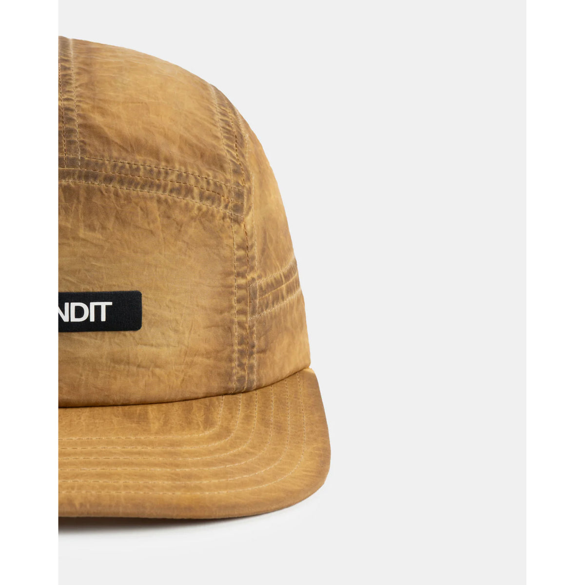 Bandit Nylon HumoFit Lunar Wash Run Hat Copal close-up of front showing printed Bandit logo with silky nylon construction and branded taping detail