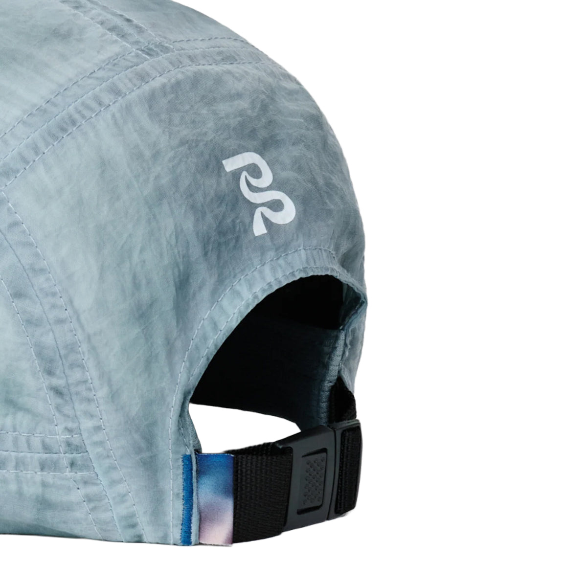Bandit Nylon HumoFit Run Hat in Tranquil Blue — closeup showing printed back logo, adjustable back buckle and seasonal printed woven tab detail on tranquil blue silky nylon construction