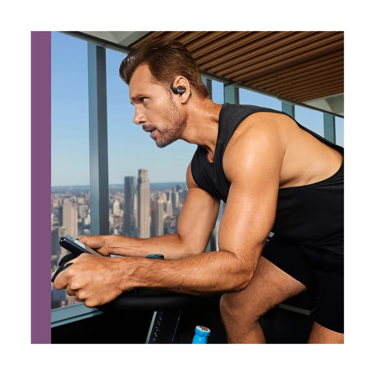 Shokz OpenFit Pro Headphones Black on model in lifestyle setting showing open-ear design with Shokz Ultra-Soft Silicone 2.0 for pressure-free all-day comfort during commuting and daily use