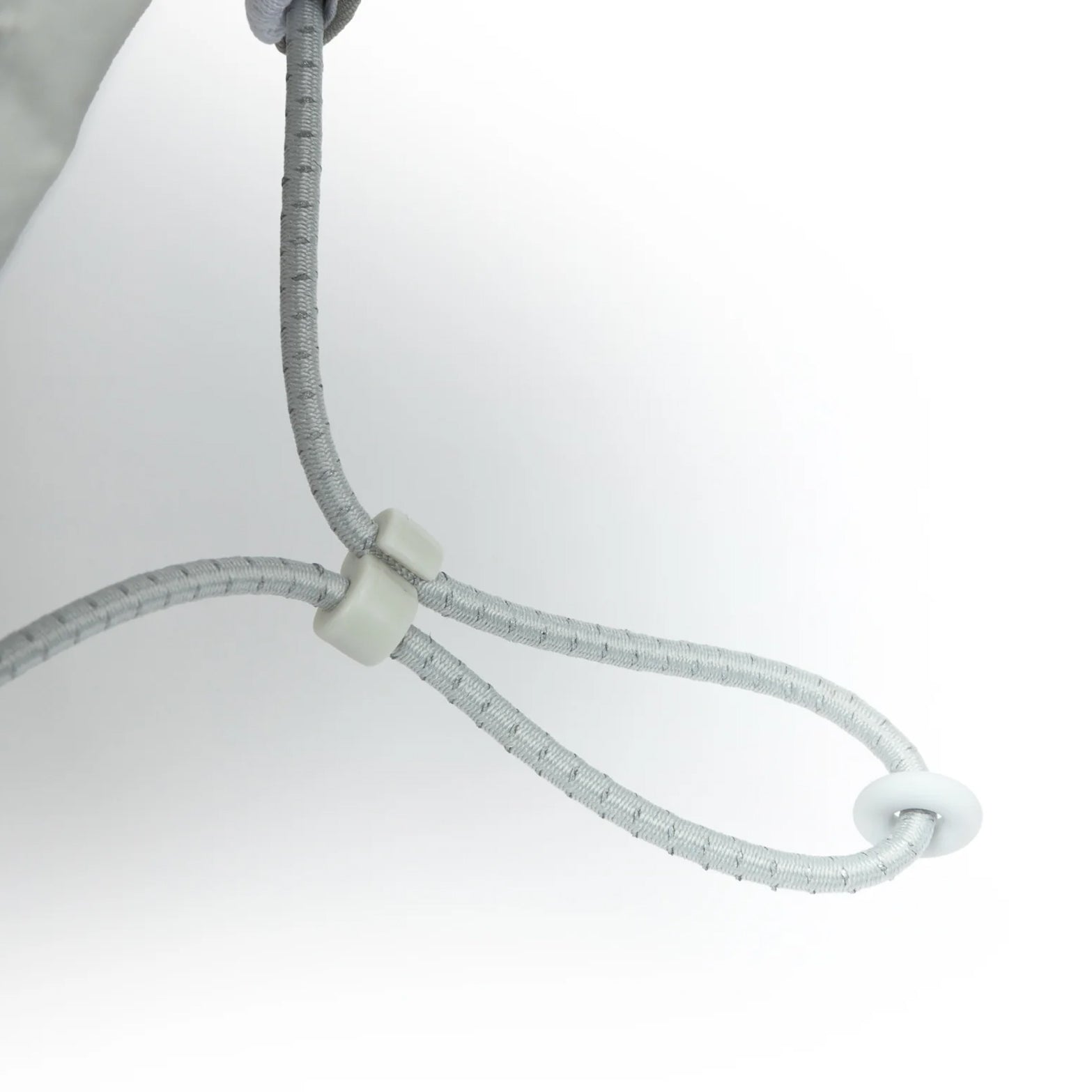 Satisfy PeaceShell Cordura Trail Cap in Light Grey — closeup showing adjustable rear closure system detail on light grey PeaceShell™ Cordura construction