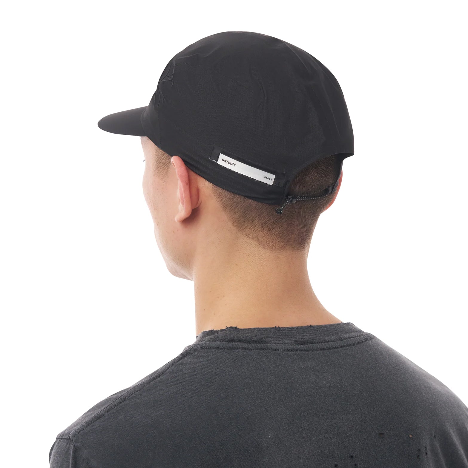 Satisfy Pertex® 3L Rain Cap in Black — back view worn on model showing adjustable bungee closure and black Pertex® Shield Air three-layer nano-ripstop construction