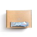 A box of SAP25 Energy Gel - Box of 10 from SAP, featuring a single silver packet labeled Canadian Maple and offering a balanced 50:50 carb ratio for maple syrup fuel, sits atop the brown cardboard box against a white background.