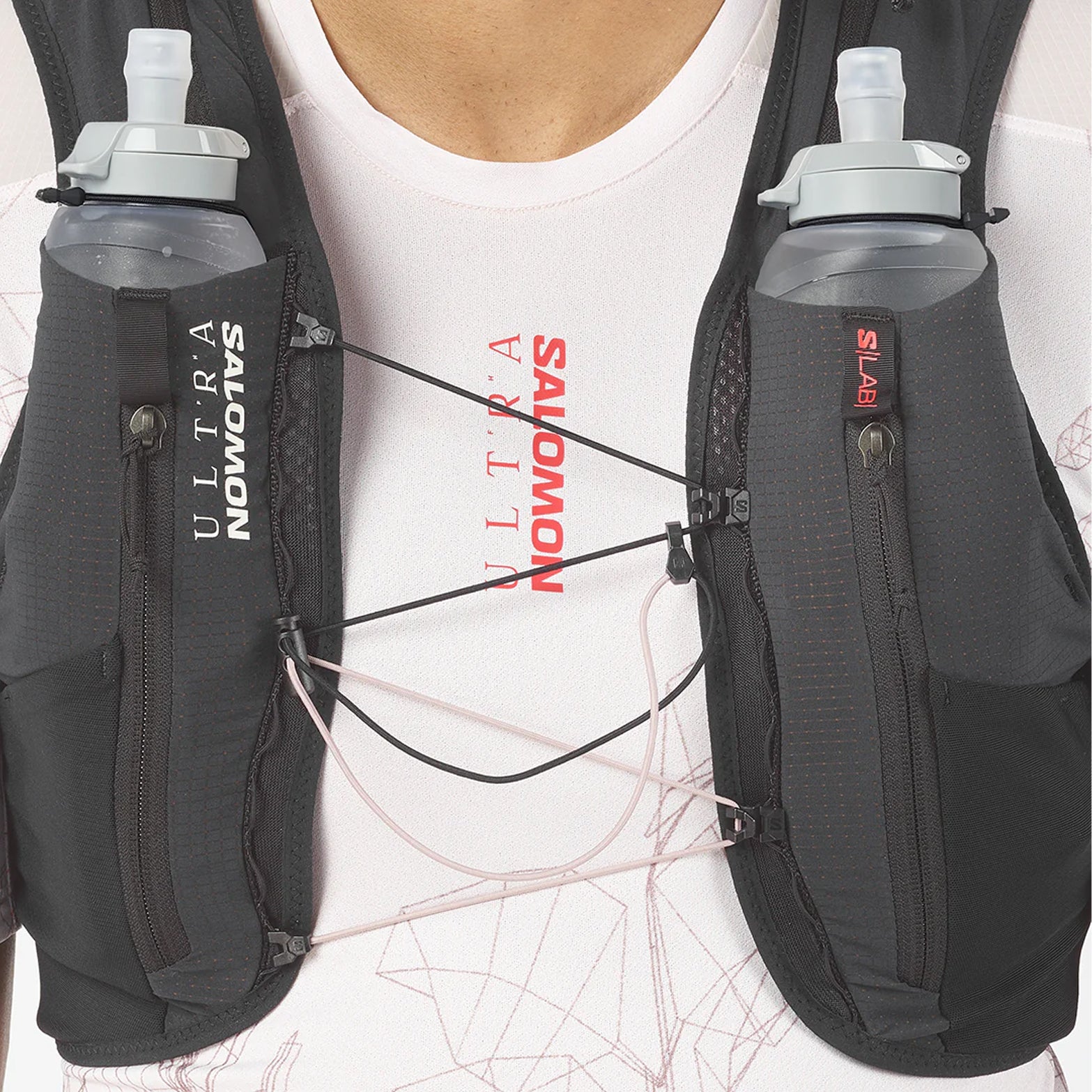 Salomon S/LAB Ultra 12 Set Running Vest Black close-up front view on model showing soft flask storage, front pouches and seamless fit