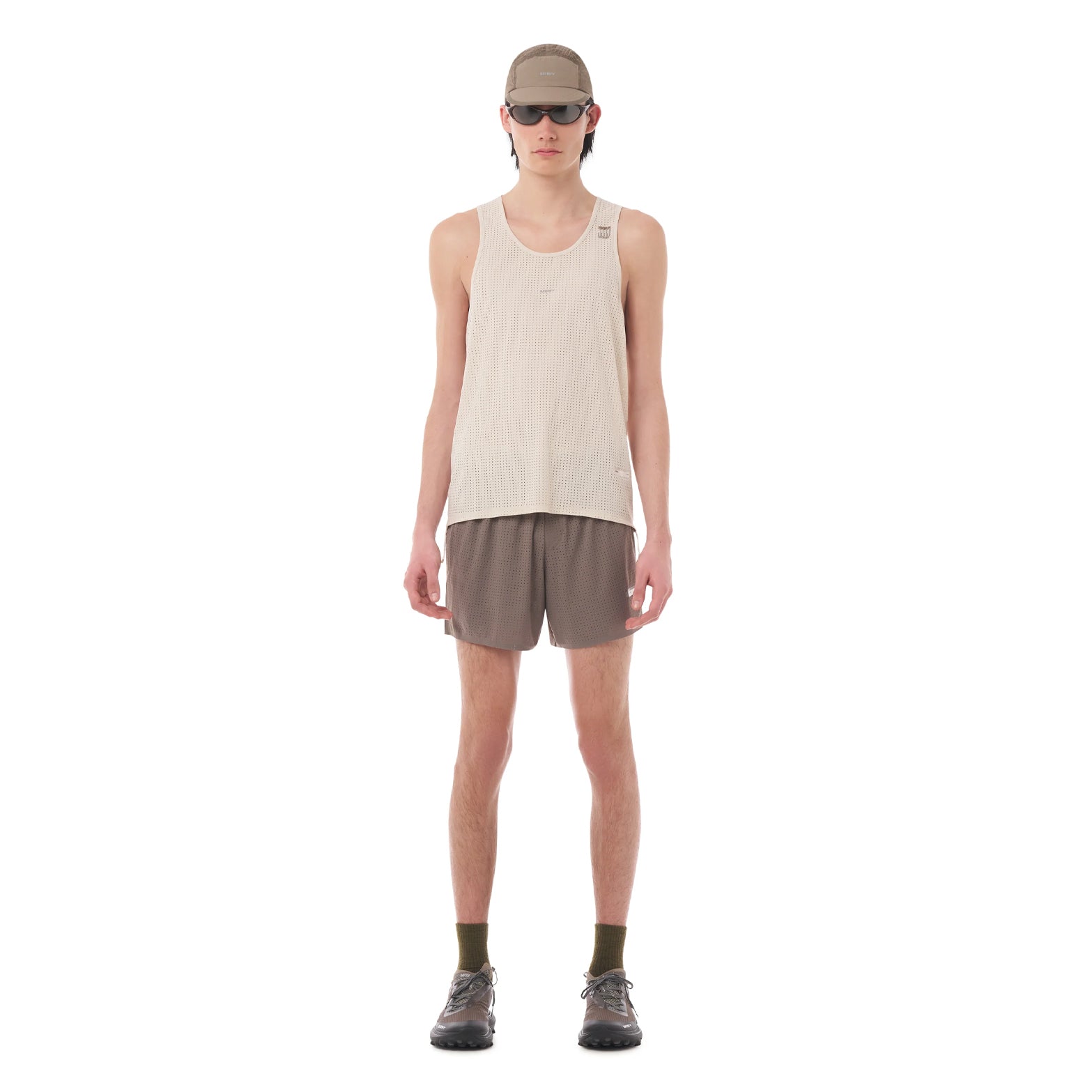 Satisfy Space-O™ Singlet in Chalk — front view worn on model showing race-cut fit, laser punch-out perforated shell and stealth-reflective Satisfy logo
