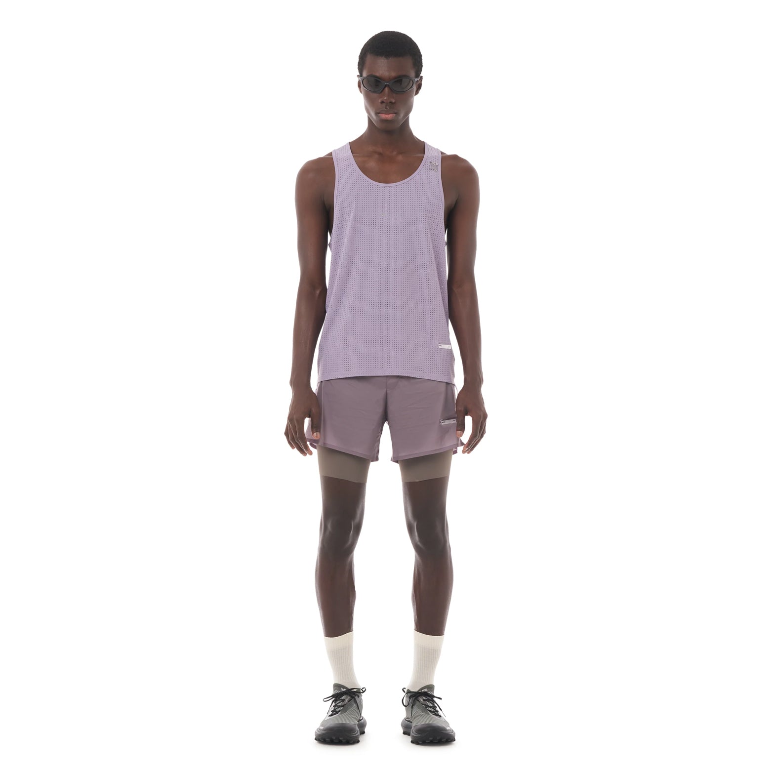 Satisfy Space-O™ Singlet in Dusk — front view worn on model showing race-cut fit, laser punch-out perforated shell and stealth-reflective Satisfy logo