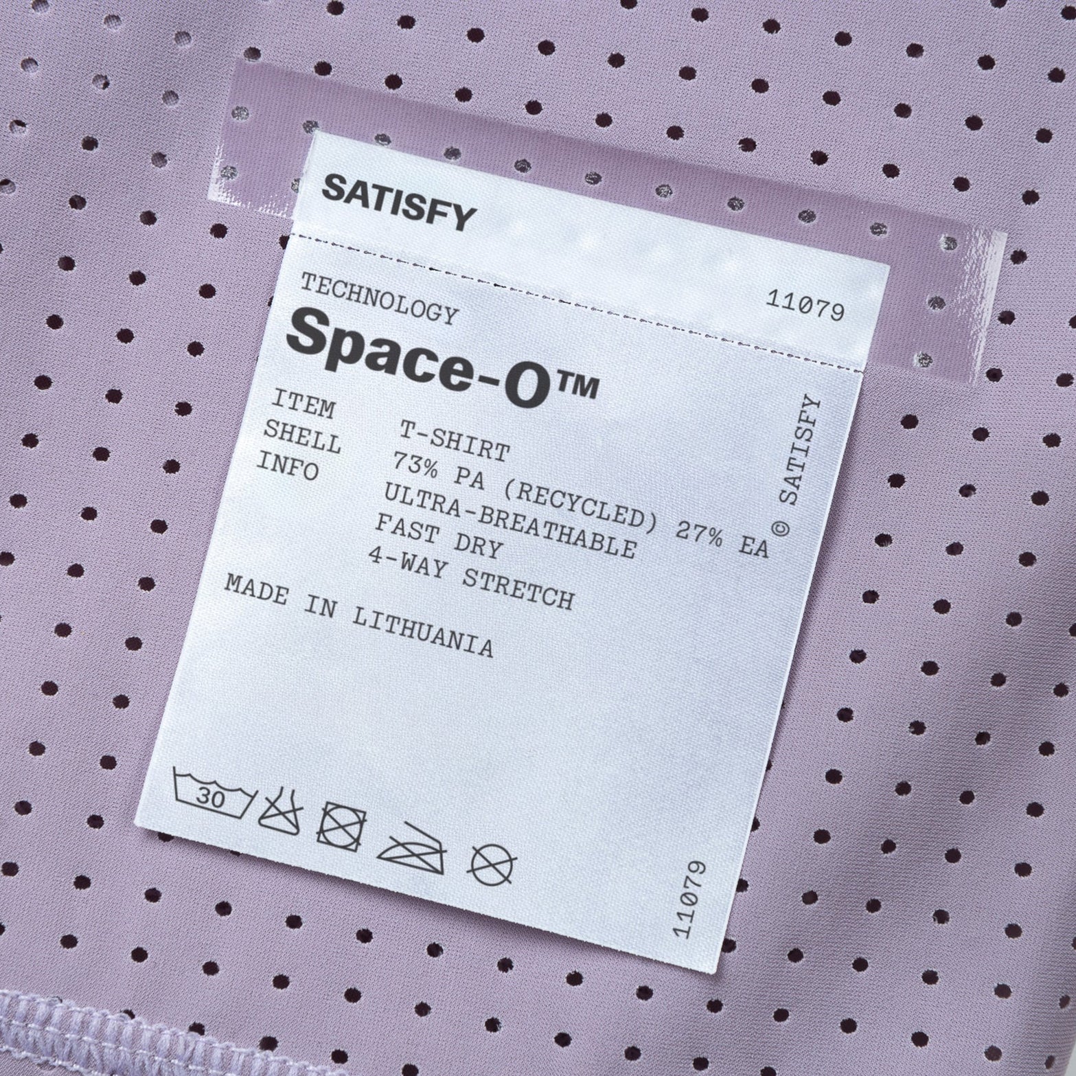 Satisfy Space-O Tee Dusk close-up of fully detachable exterior care label with nothing inside interfering with skin contact