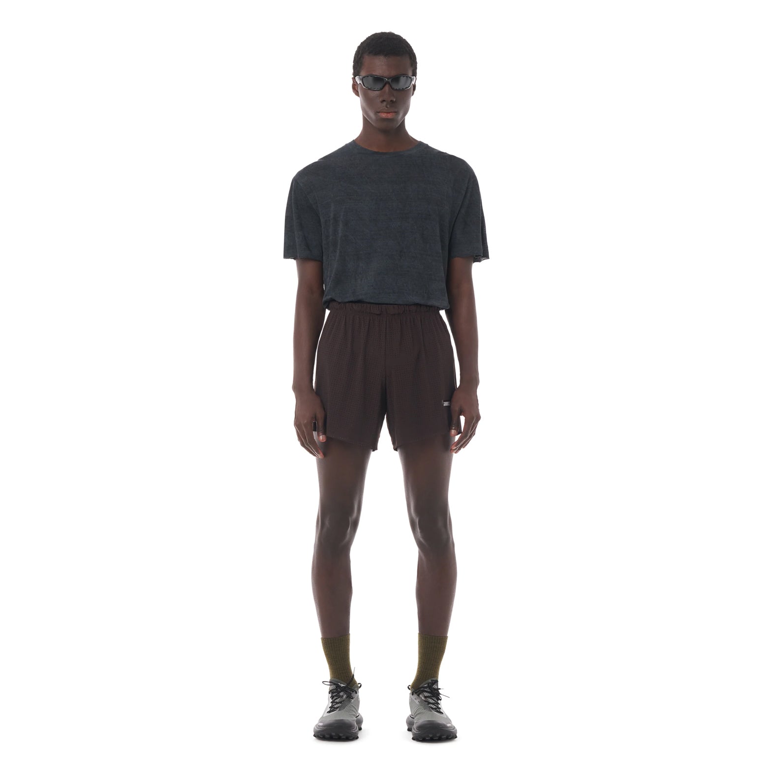 Satisfy Space-O™ 5 Inch Distance Shorts in Deep Mahogany — front view worn on model showing race-length 5" fit, laser punch-out perforated shell and stealth-reflective Satisfy logo