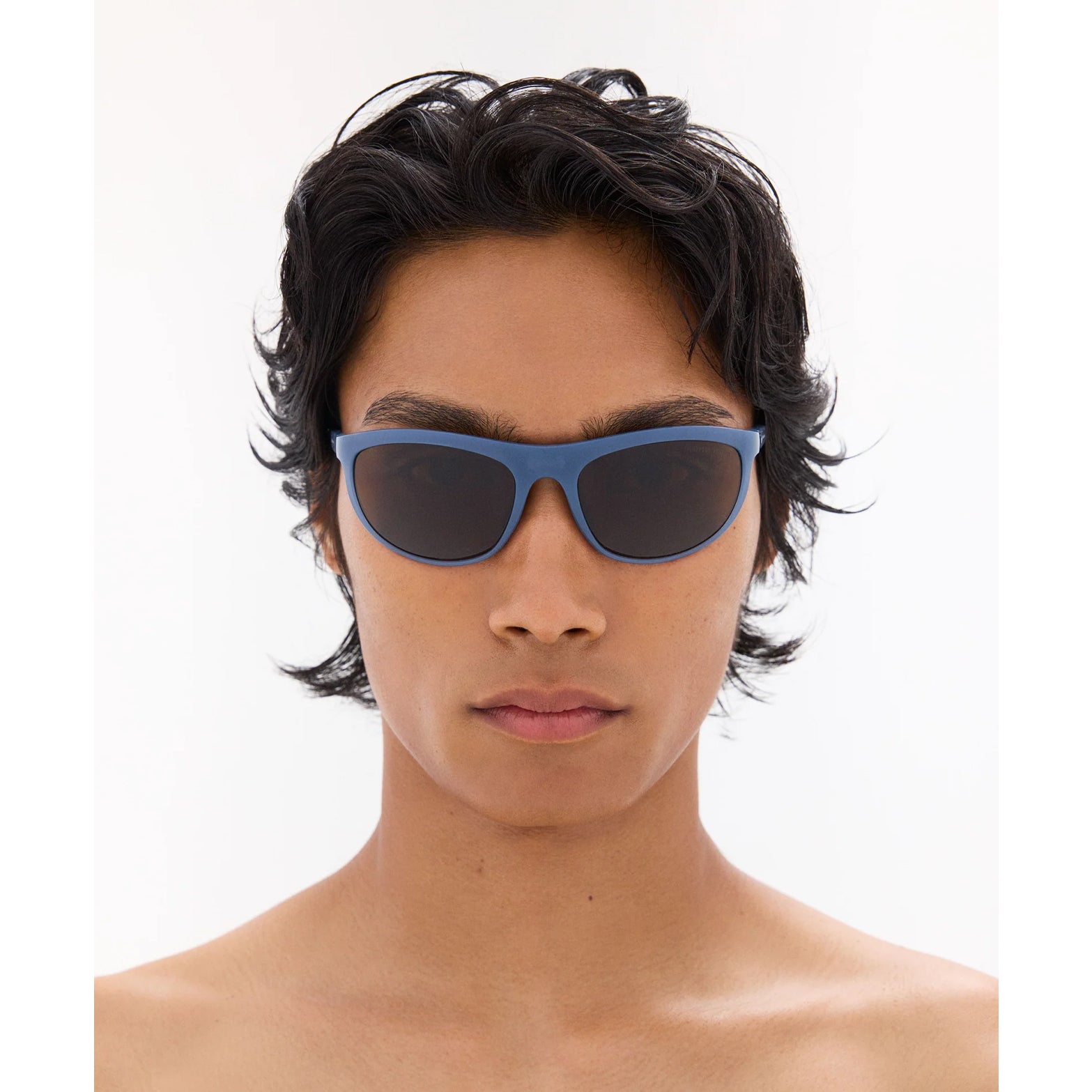 District Vision Takeyoshi Altitude Master in Cold Water D+ Copper — worn on male model showing eight-base frame fit, cold water colourway and D+ Copper lens in natural light