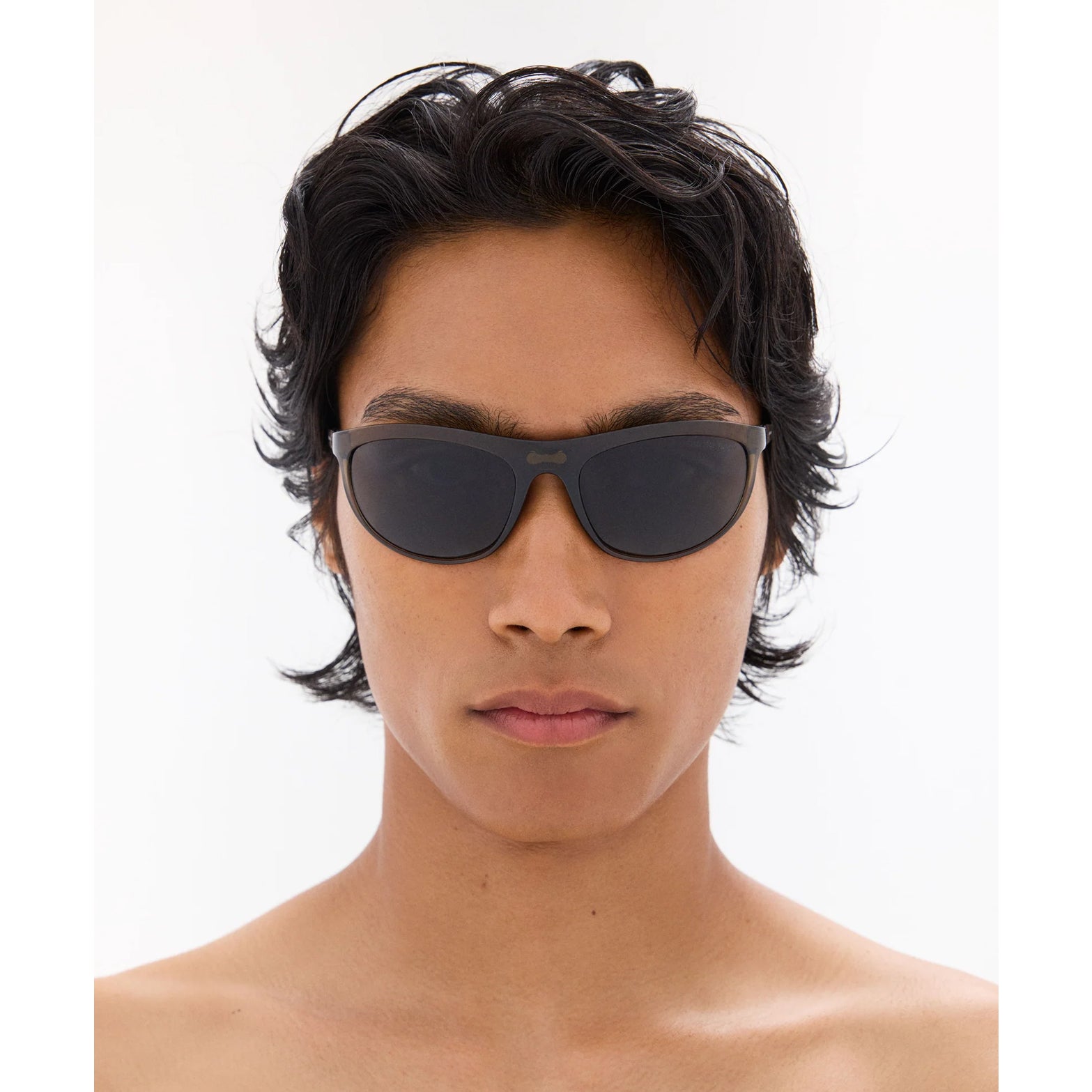 District Vision Takeyoshi Altitude Master in Liquid Moss D+ Water Grey — worn on male model showing eight-base frame fit, liquid moss colourway and D+ Water Grey lens in natural light