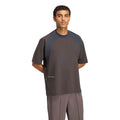 A person wearing a Unisex H.Koumori Tee Night Brown / Night Grey adidas running tee in brown and dark grey with a side zipper and small logo detail.