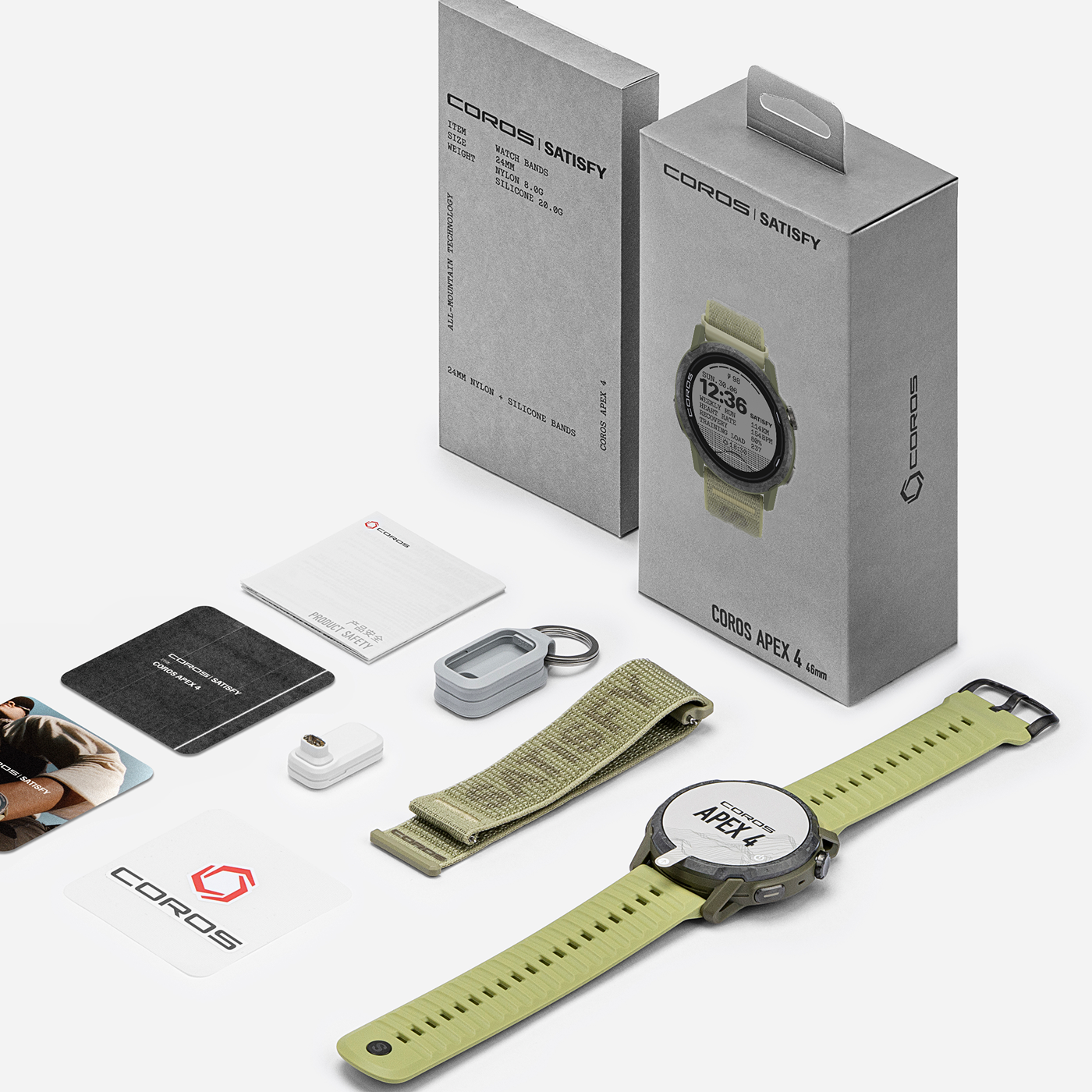 X Satisfy Apex 4 GPS Sport Watch in Burnt Olive, with watch, extra strap, keychain, charger, cards, manual, and two gray branded boxes all neatly arranged on a white background.