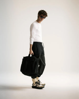 District Vision Men's Ultralight DWR Paneled Track Pants Black - achilles heel
