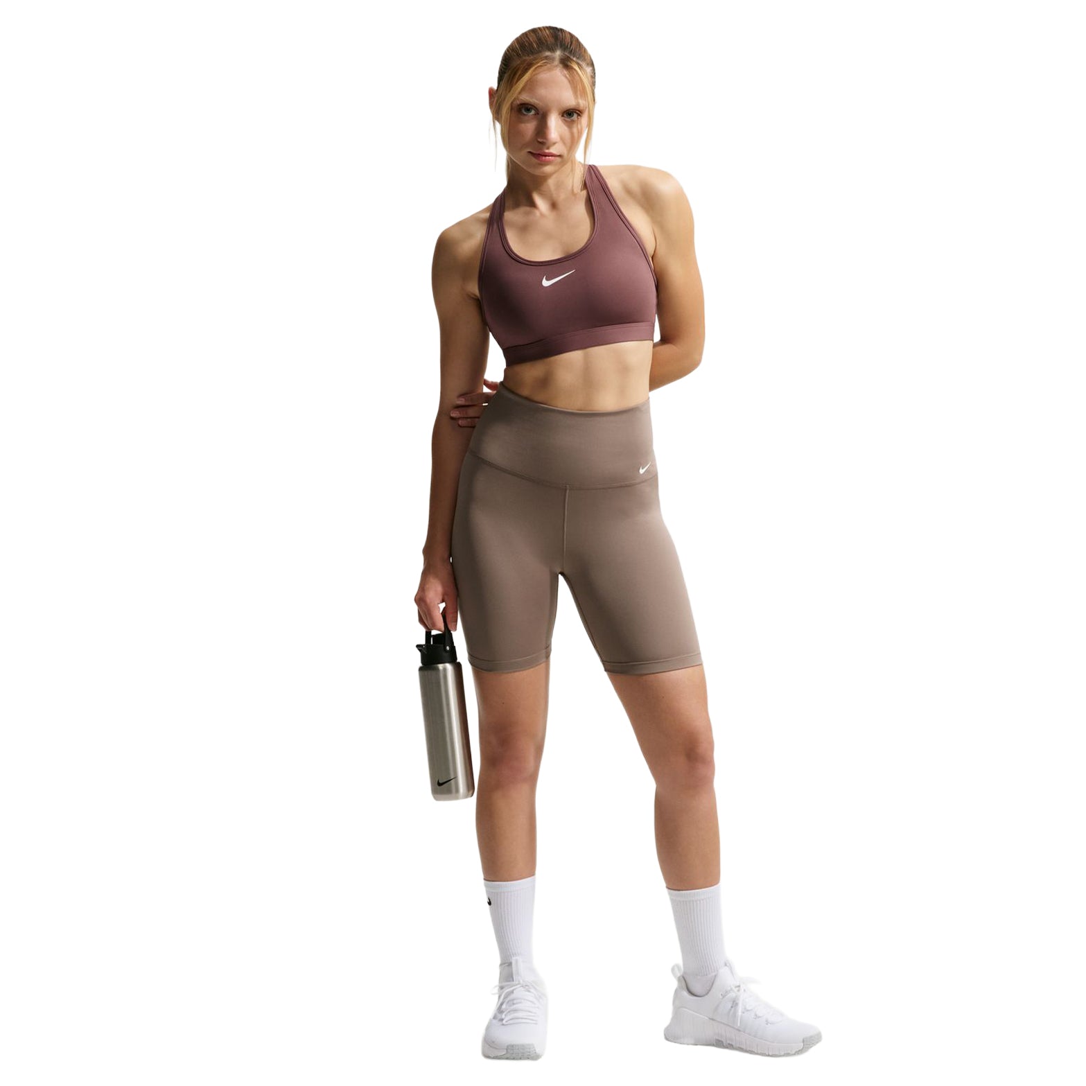 Nike Swoosh medium support padded sports bra front full body view on model showing comfortable fit