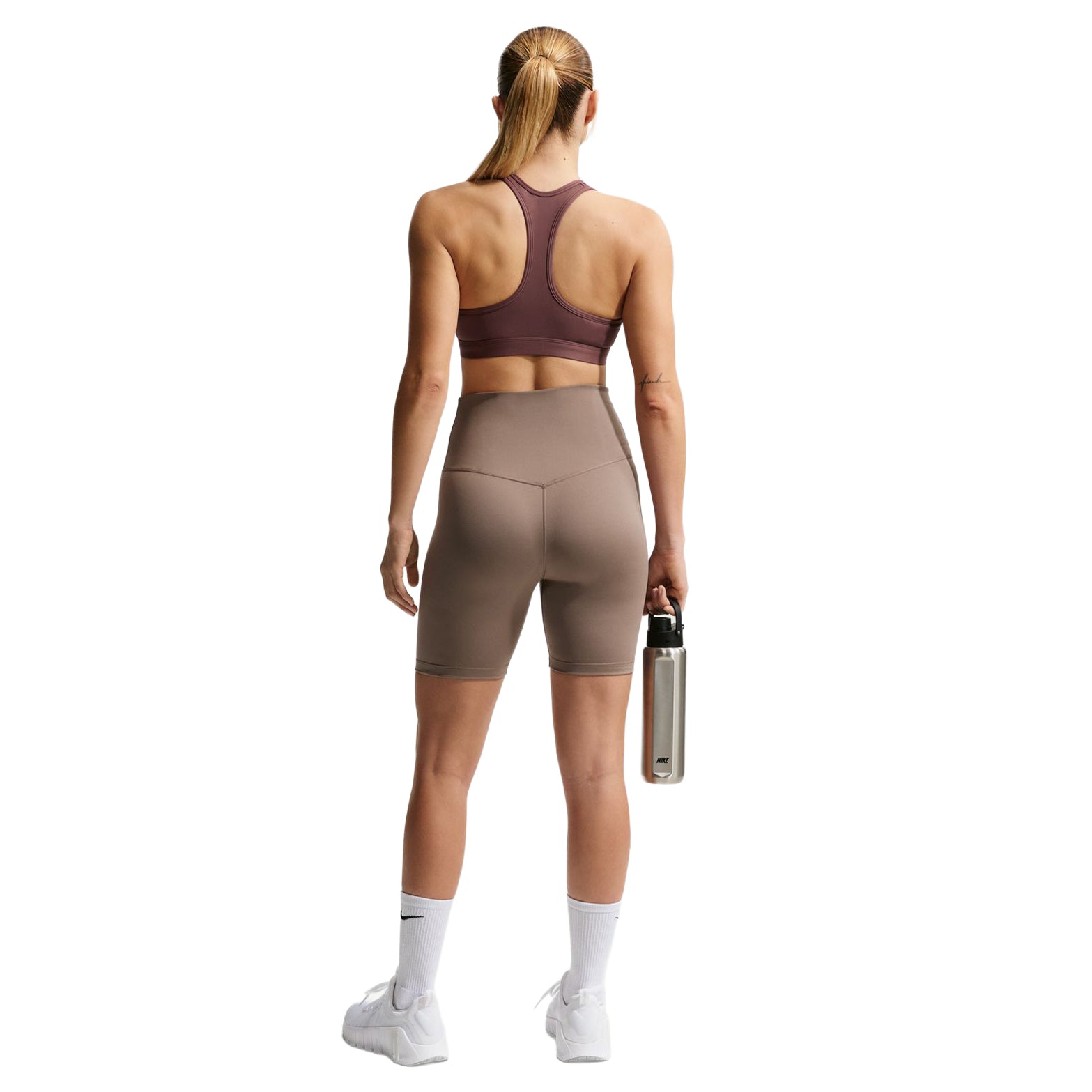 Nike Swoosh women's sports bra back full body view on model highlighting secure support design