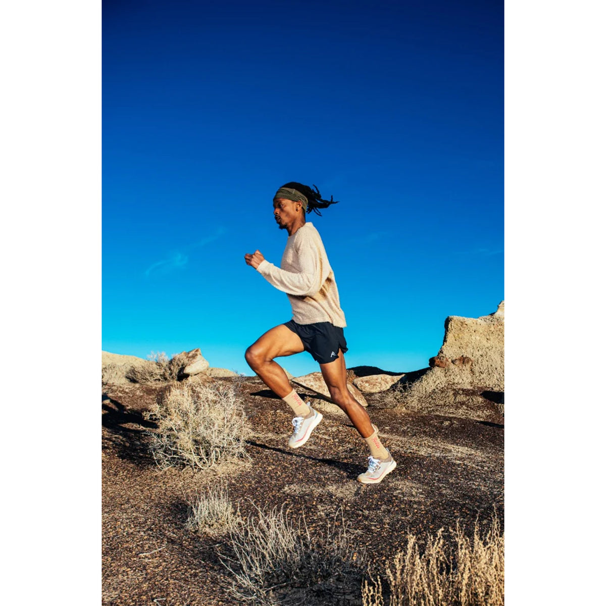 norda 001A Trail Running Shoes Sky worn by runner in motion showing ultra-distance trail running performance and Vibram Mega Grip traction