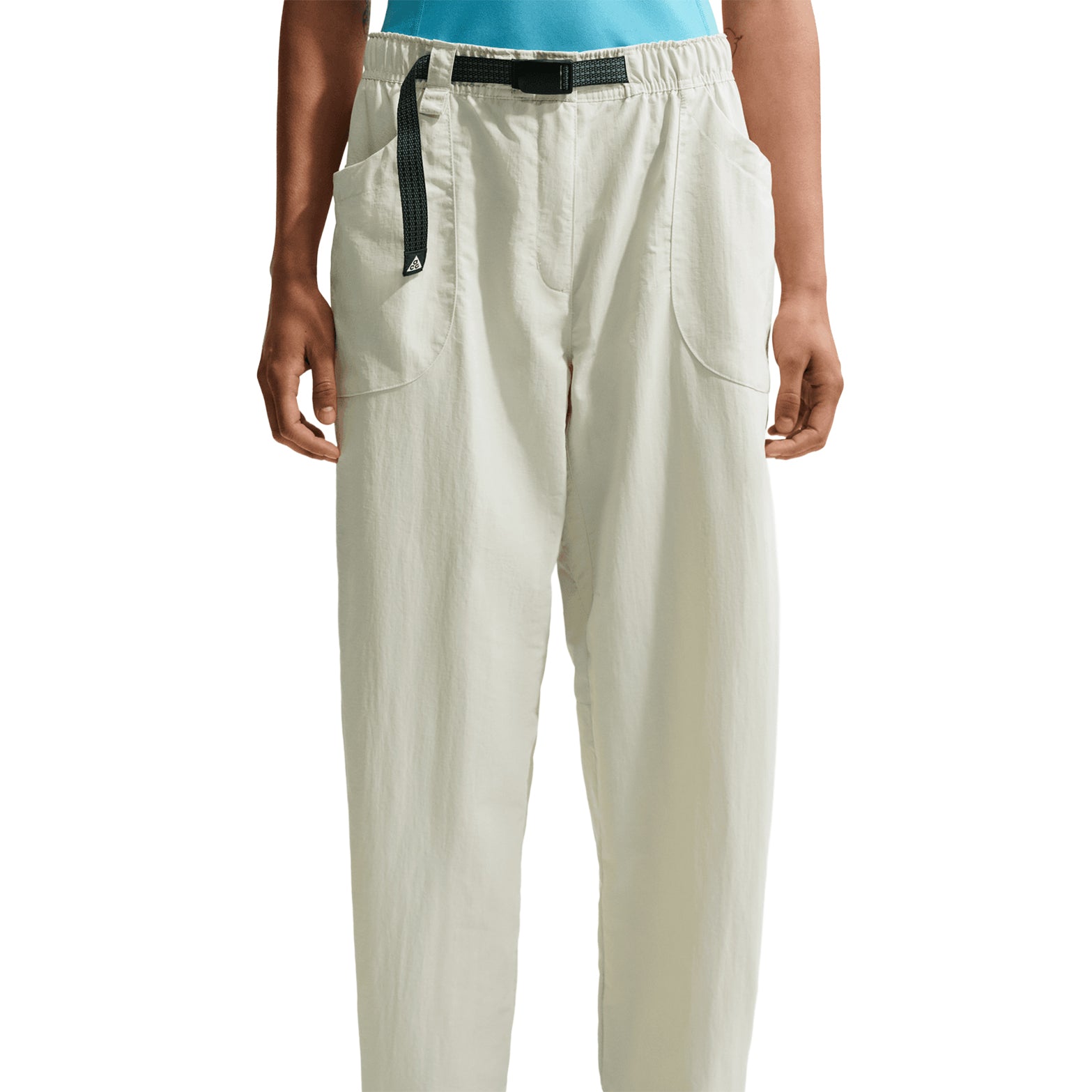 Nike ACG Dolomiti women's trousers in Sea Glass / Black — front product shot showing sea glass water-repellent nylon with black detailing, loose fit and adjustable bungee hem