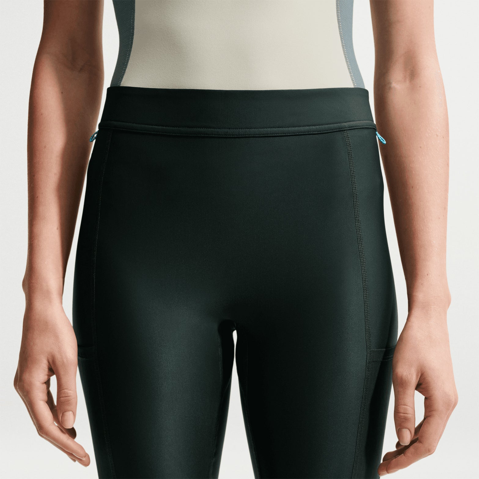 Women's Nike ACG Five Towers Skort Sea Glass Spruce Fog Summit White showing shorts configuration with skirt flap removed using side buttons and drop-in pockets on biker short