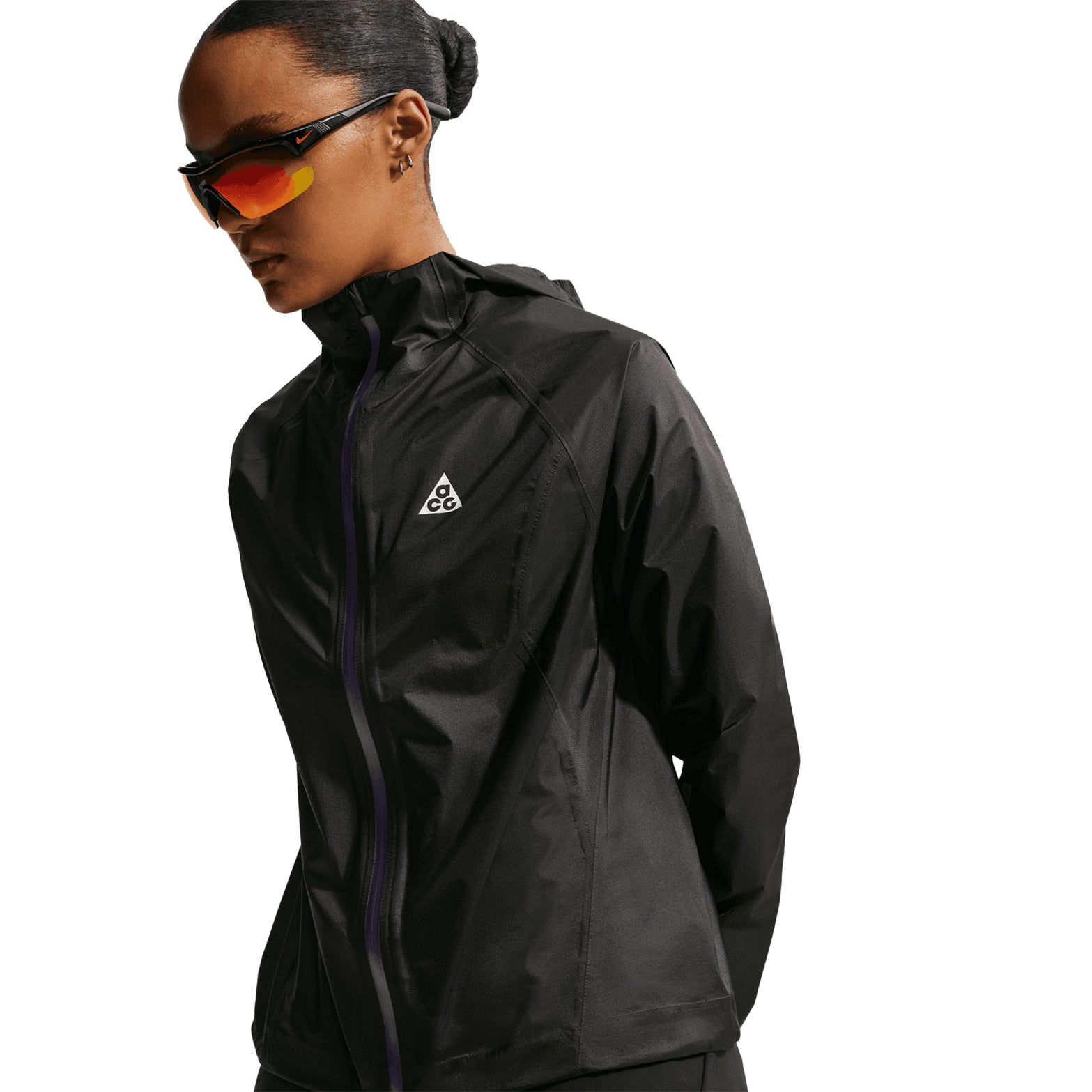 Women's Nike ACG Trailwind Storm-FIT ADV Jacket Black Summit White front product view showing ultra-lightweight nylon with Storm-FIT ADV windproof waterproof construction and bungee-adjustable hood