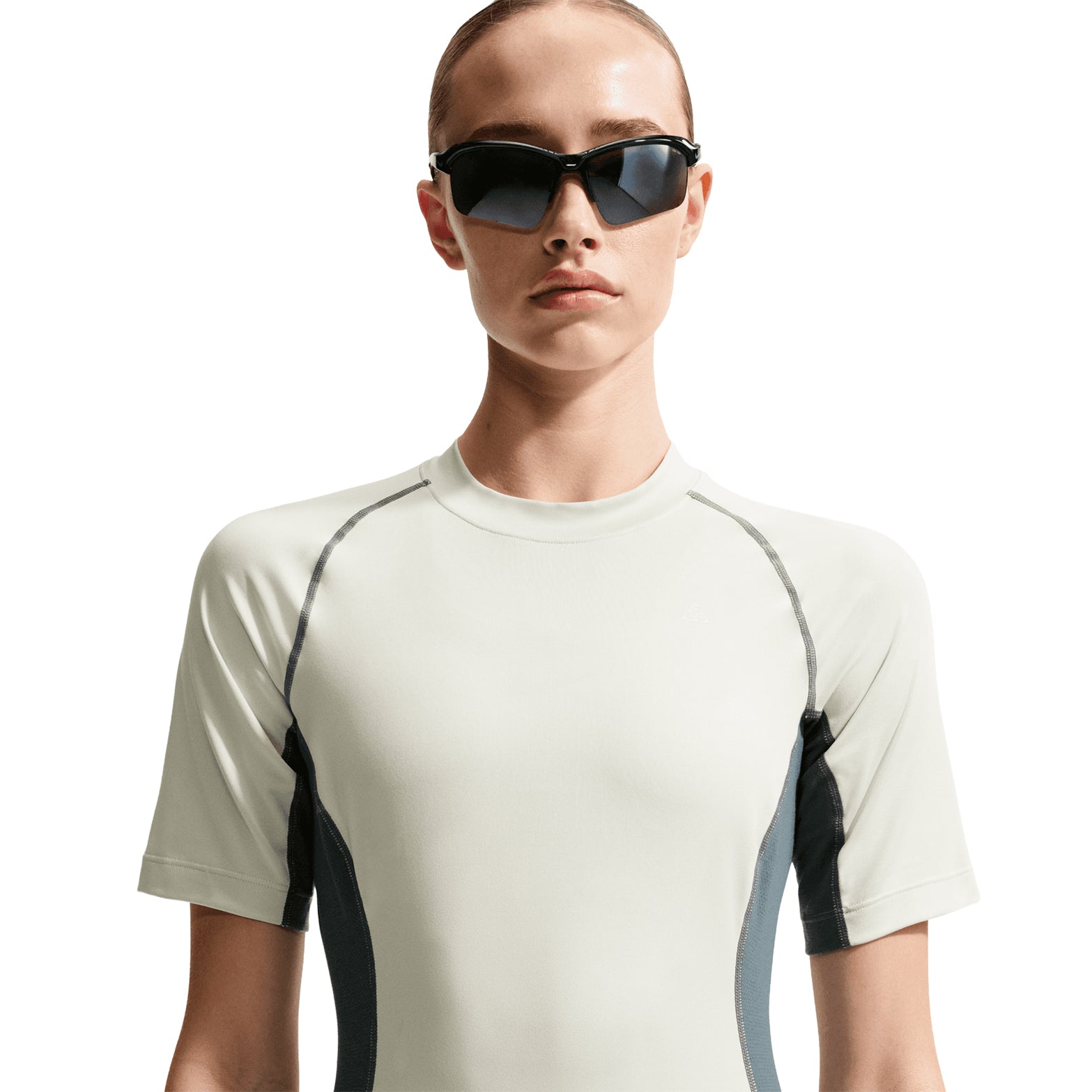 Women's Nike ACG Wildsee Base Layer Tee Sea Glass Mineral Slate Summit White front view on female runner showing snug base layer fit with UV-resistant Dri-FIT fabric for trail running and mountain activities