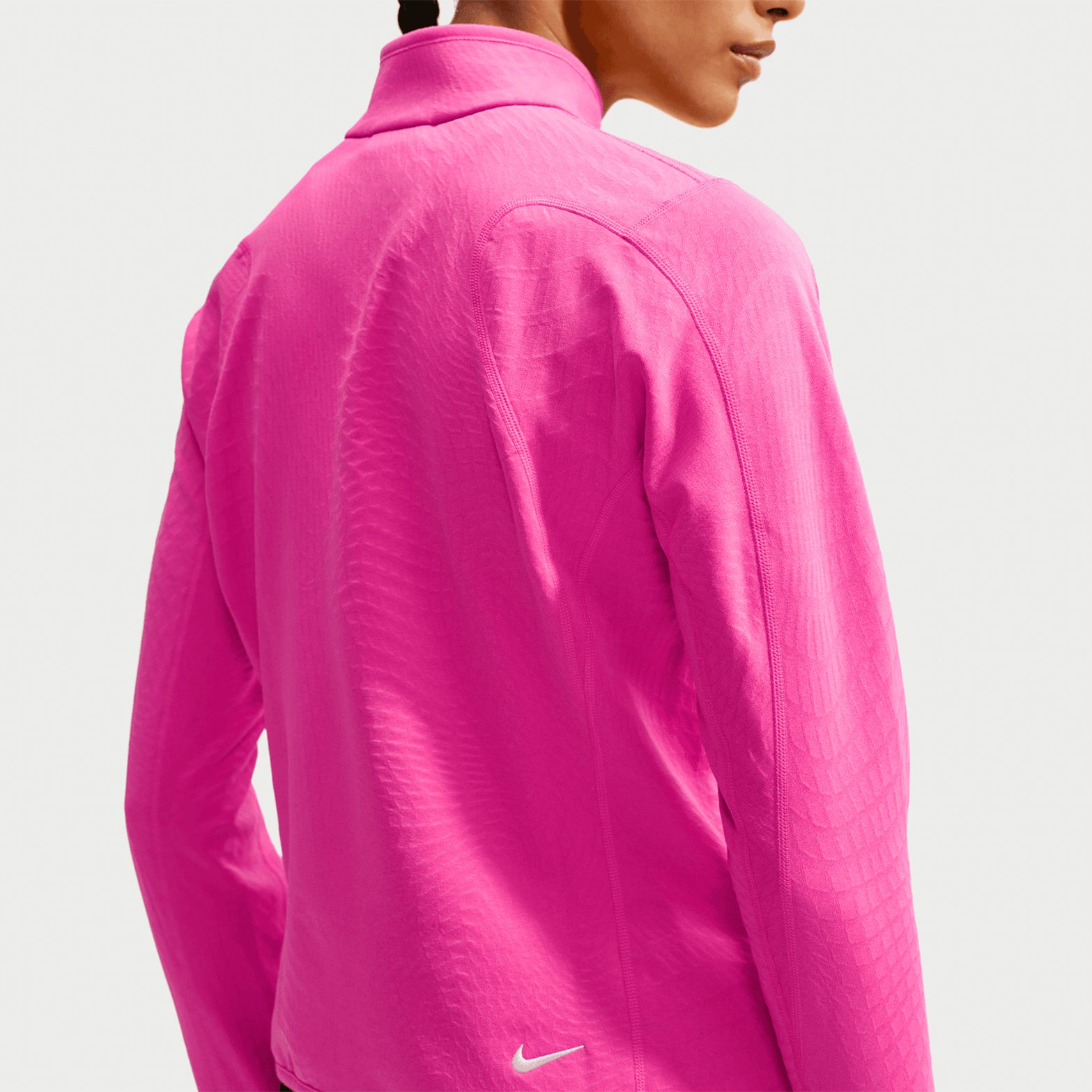 Women's Nike ACG Wolf Grid Therma-FIT 1/2 Zip Top Desert Pink Light Crimson Summit White back view showing grid-back fleece construction with Therma-FIT technology and flat seam shoulder panels for unrestricted movement