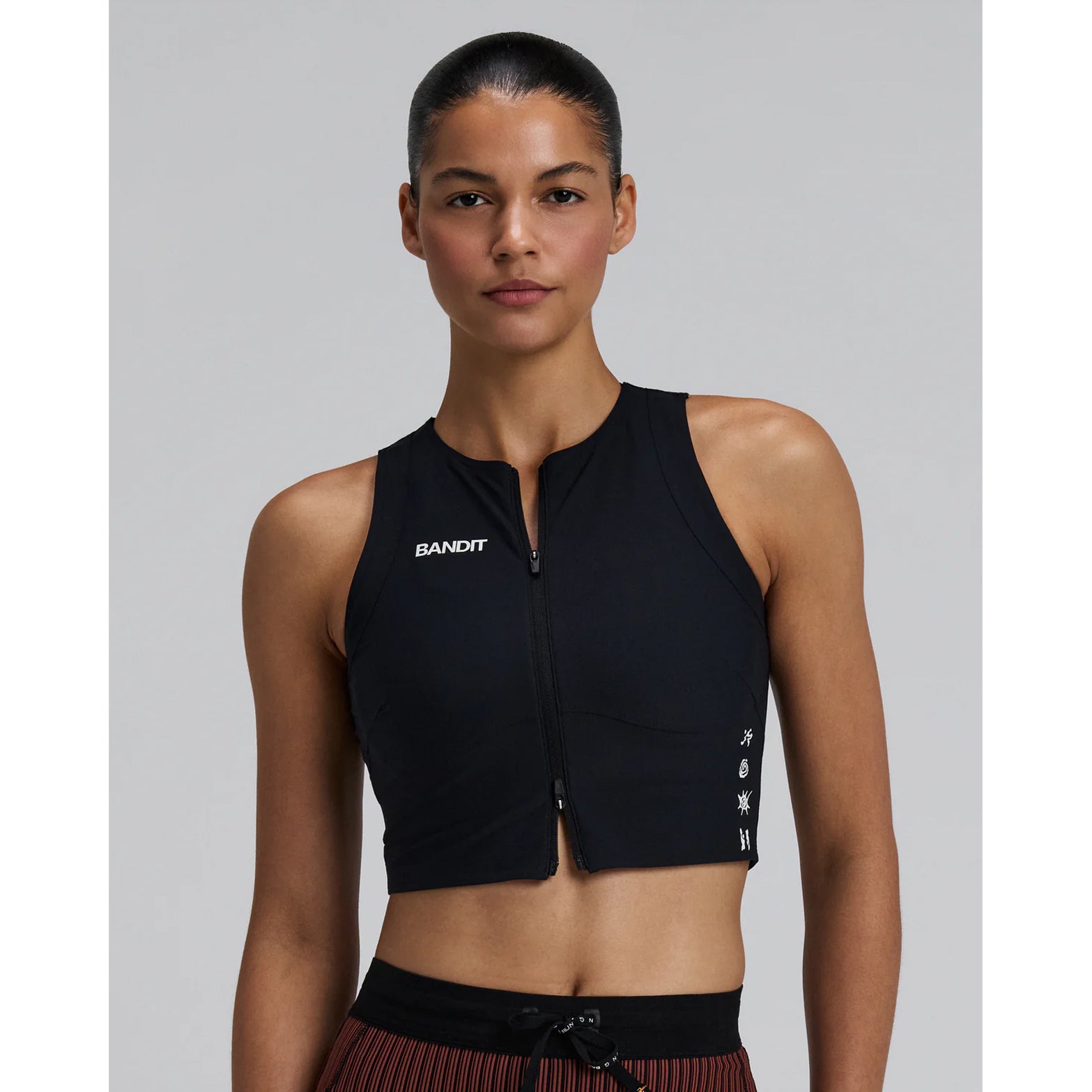 Women's Bandit Adapto Distance Race Top Black front view showing ultra-light Adapto four-way stretch compression fabric with 2-way zipper and reflective branding