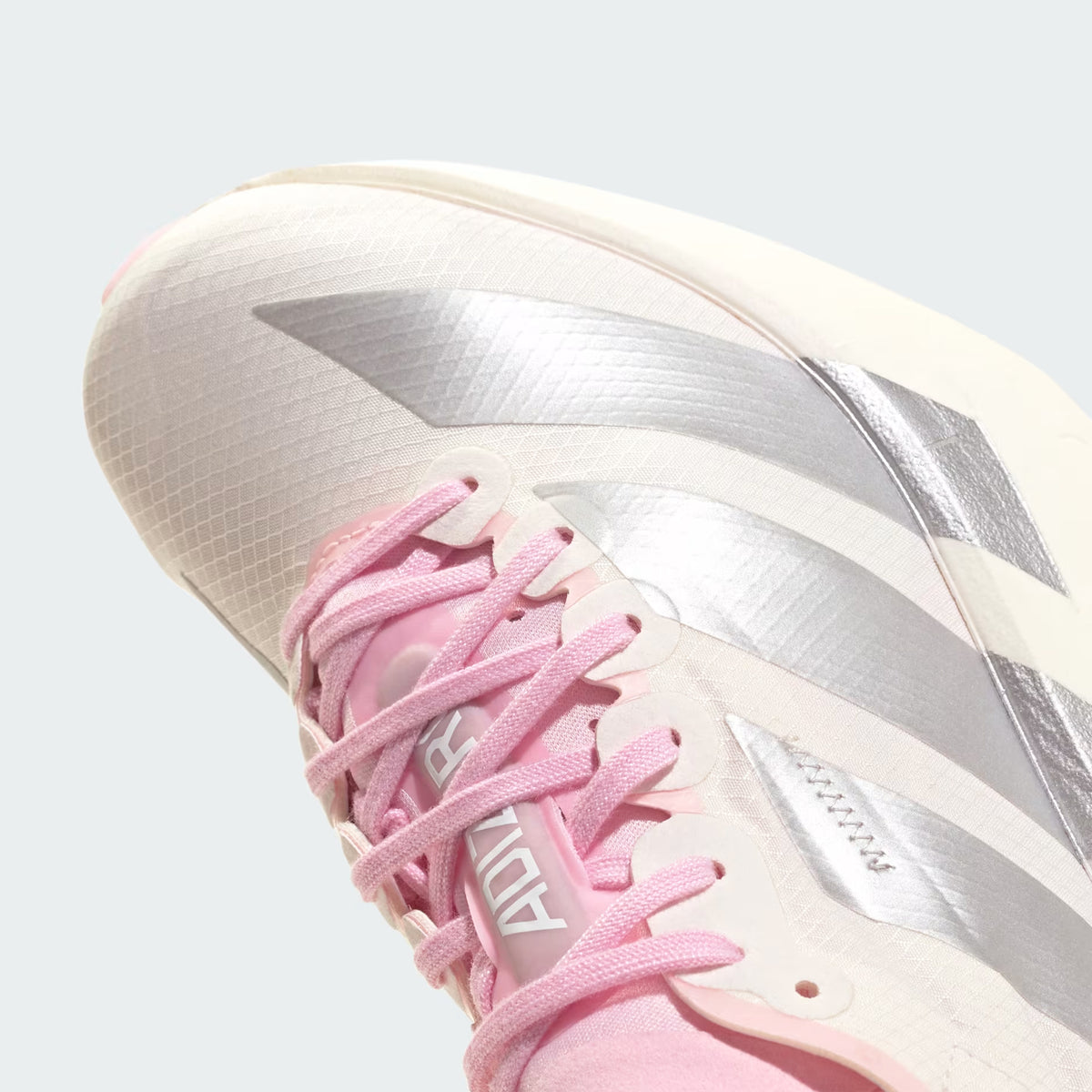 Women's adidas Adizero Adios Pro 4 Running Shoes Core White Silver Metallic Clear Pink angled front view showing lightweight racing upper construction and carbon-plated racing geometry