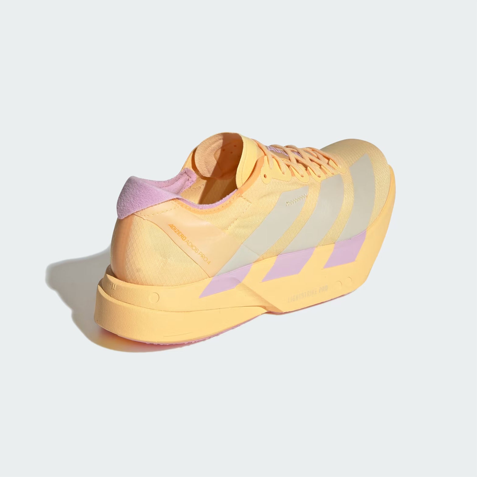 Women's adidas Adizero Adios Pro 4 Running Shoes Orange Pink angled heel view showing double-layer LIGHTSTRIKE PRO cushioning stack and carbon ENERGYRODS 2.0