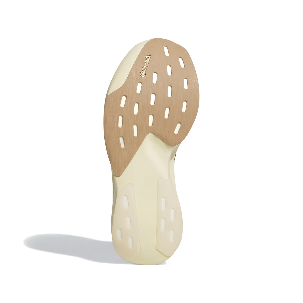 The image displays the beige and tan rubber outsole of the Women’s Adizero EVO SL EXO Suede Running Shoes in Core White, Team Victory Red, and Cream White by Adidas, highlighting white rectangular grip patterns and Continental branding near the top. This innovative outsole is paired with the advanced EXOSKELETON Fit System for enhanced support, all captured against a white background.